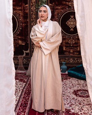 Beige Samaa Kaftan by THT GIRL, featuring elegant flowing fabric and intricate embroidery, perfect for stylish occasions.