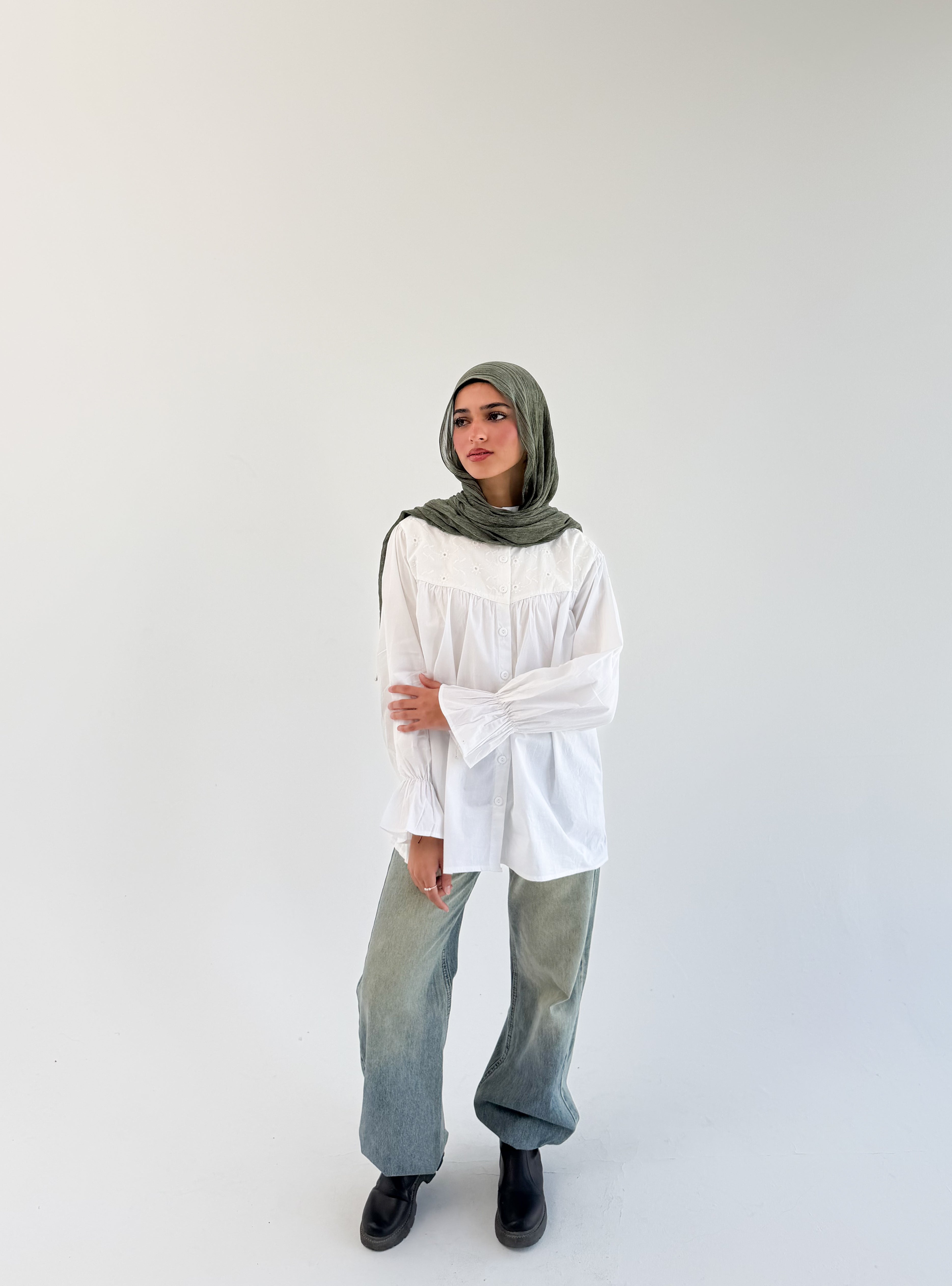 White Lady Blouse by THT GIRL, featuring a stylish, lightweight fabric and classic design, displayed on a hanger.