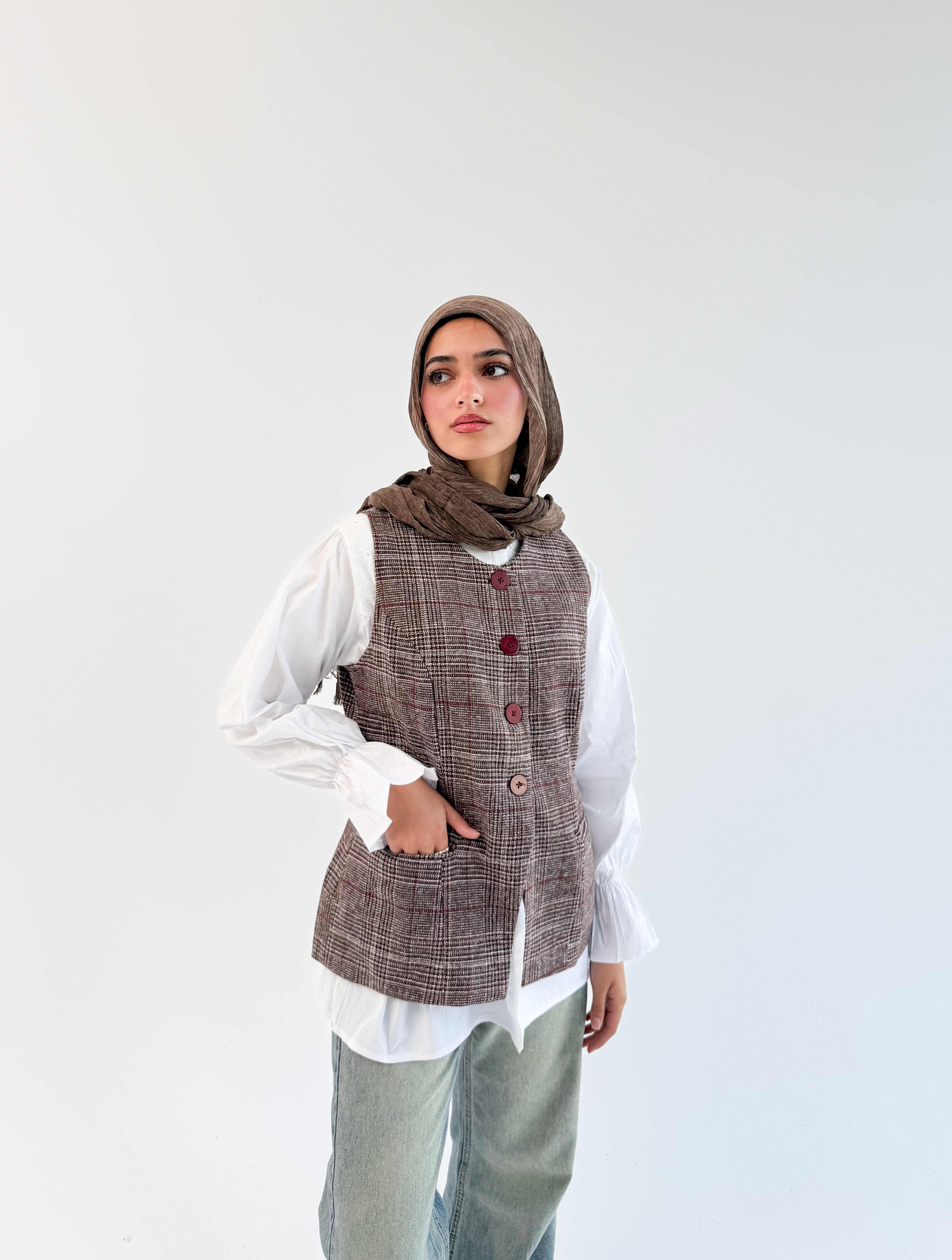 THT GIRL London Vest in Burgundy check fabric, featuring a stylish sleeveless design with button details and a tailored fit.