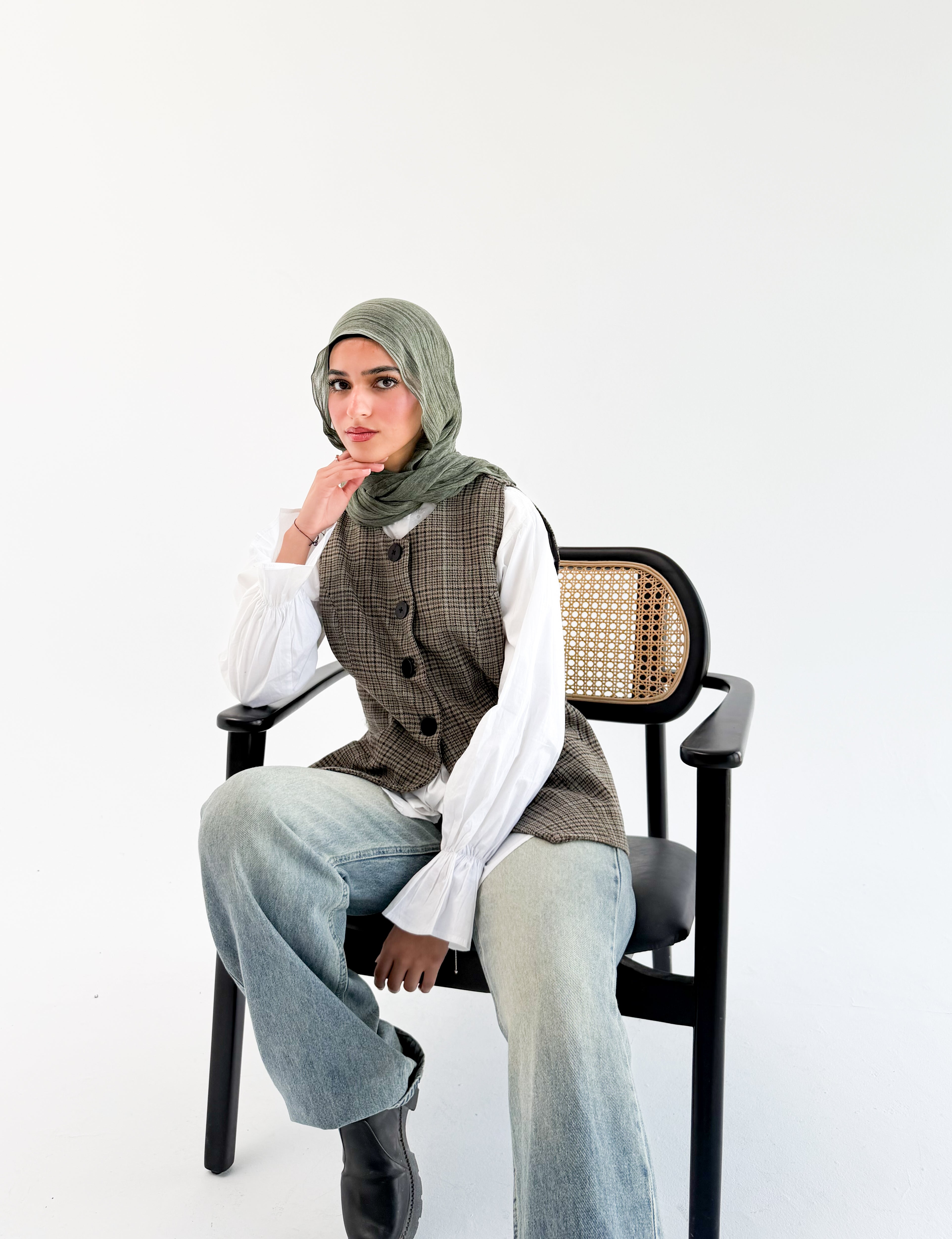 Olive check London vest by THT GIRL featuring a stylish check pattern and sleeveless design on a plain background.