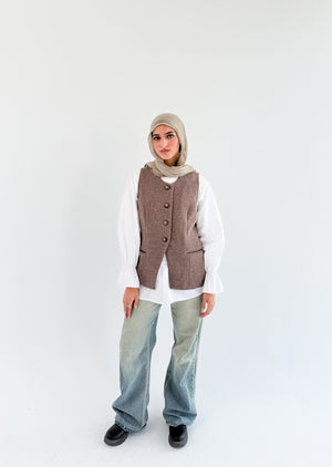 THT GIRL London Vest coffee-colored sleeveless vest with front pockets, styled on a mannequin.