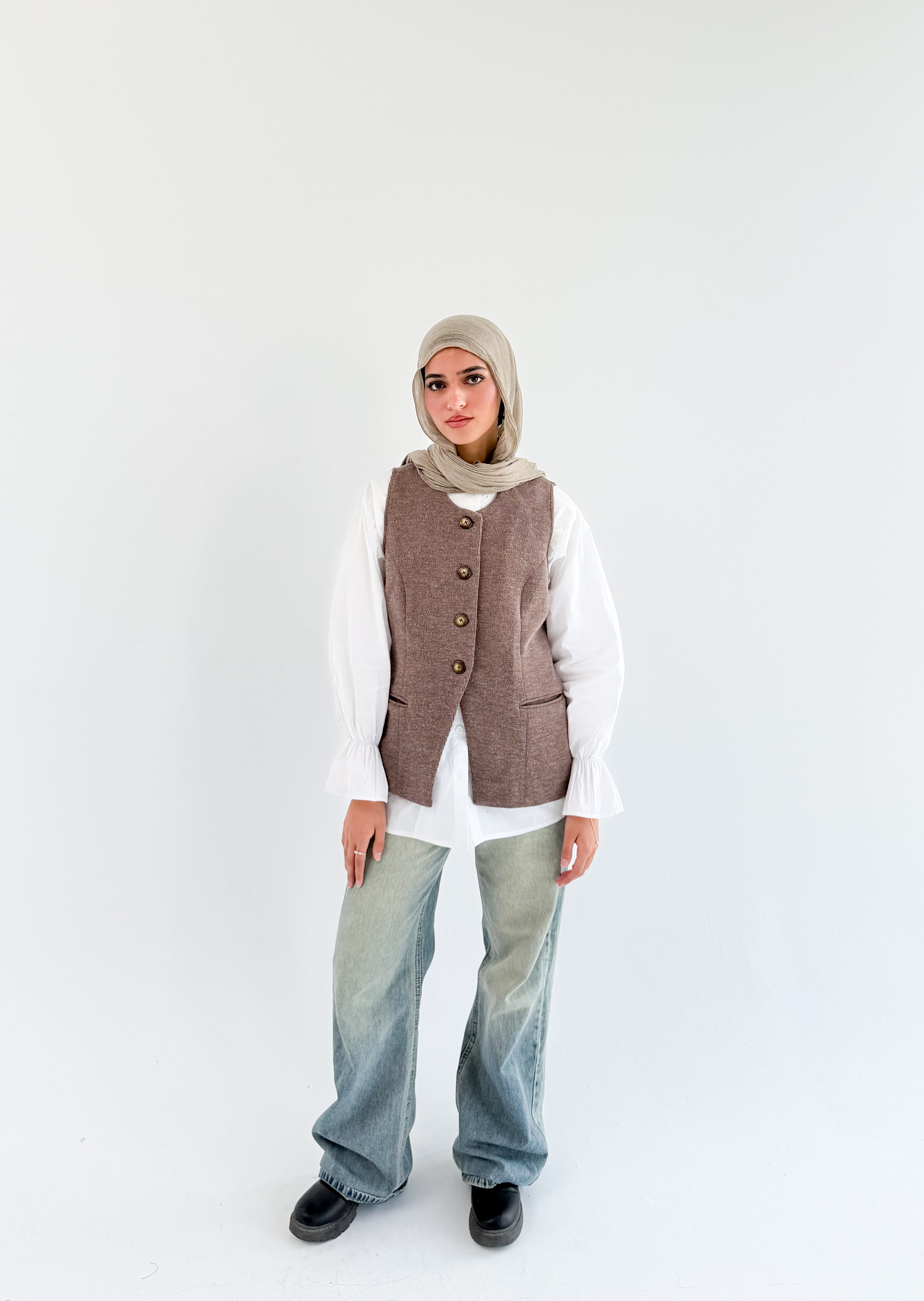 THT GIRL London Vest coffee-colored sleeveless vest with front pockets, styled on a mannequin.