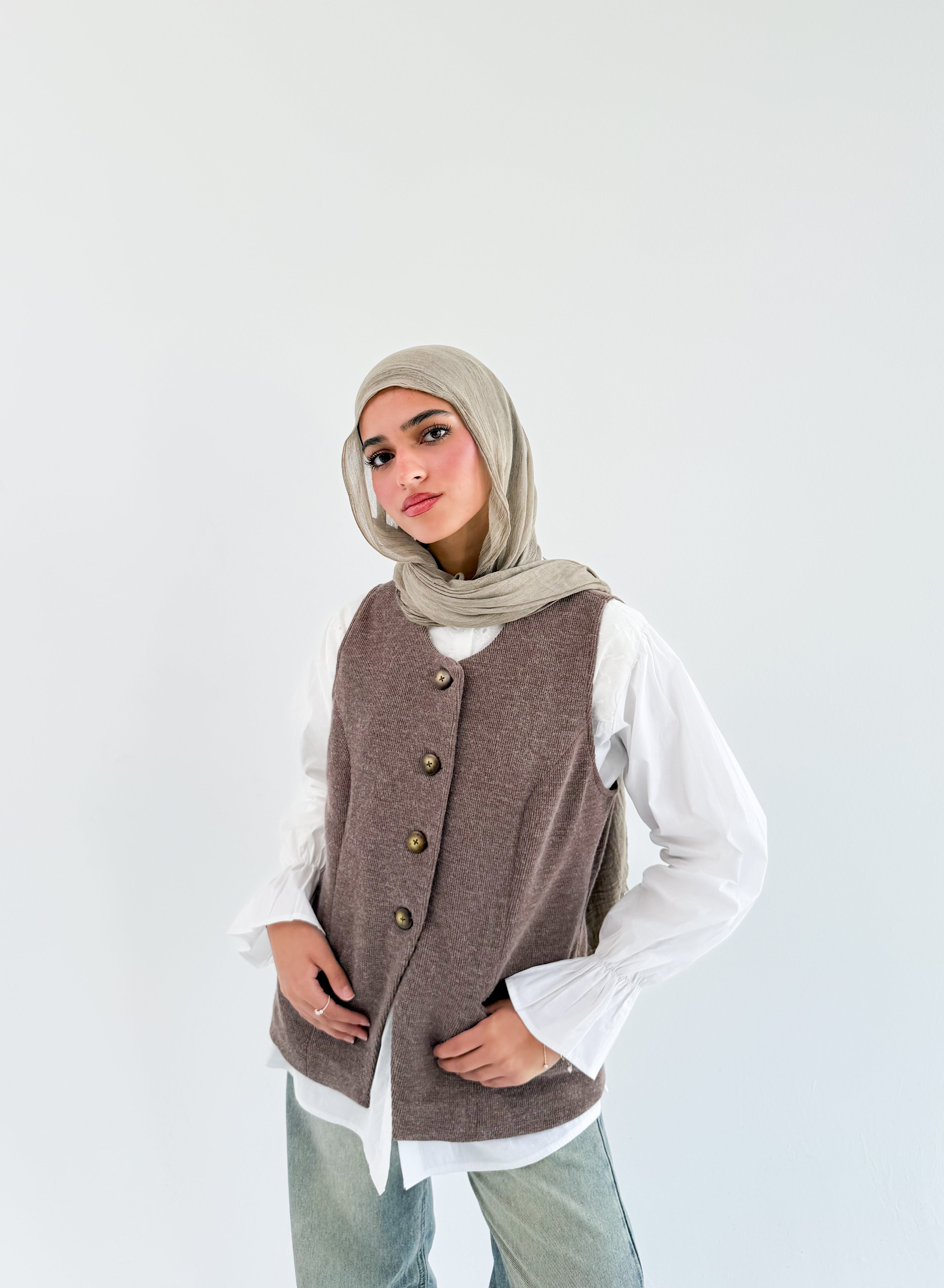 THT GIRL London Vest coffee-colored fabric with front zipper and collar, displayed on a hanger.