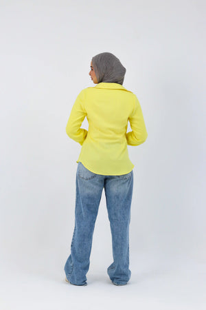 Yellow shirt featuring a deer print from THT GIRL, casual short-sleeve top with a relaxed fit, shown on a hanger.