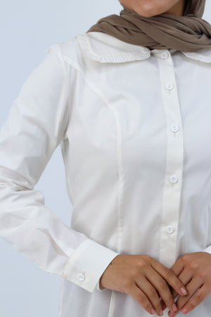 White Paris Blouse by THT GIRL, summer blouse with delicate fabric and stylish design, shown on a hanger.