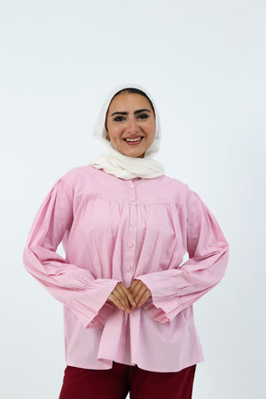 Baby pink THT GIRL Lady Blouse with long sleeves and a stylish collar, displayed on a hanger.