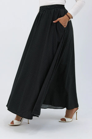 Black Riviera skirt paired with a THT Girl blouse, showing a stylish, casual outfit with a fitted black skirt and trendy top.