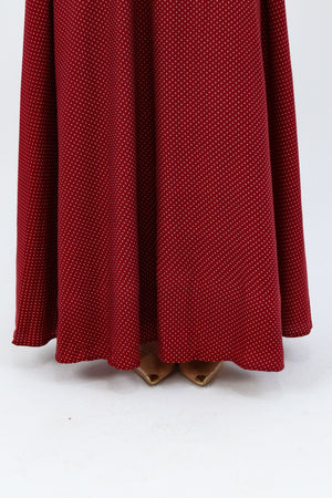 THT GIRL Burgundy Riviera skirt paired with a stylish blouse, showcasing a fashionable women's outfit in a well-lit setting.