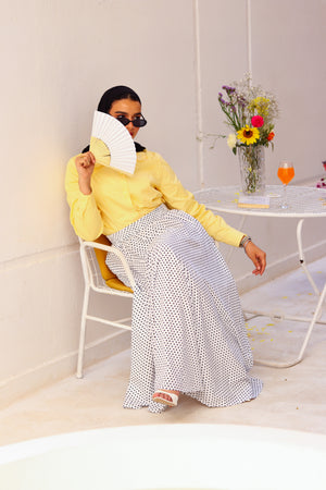 Yellow Paris blouse by THT GIRL featuring short sleeves and a lightweight summer fabric, displayed on a hanger.