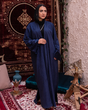 Navy Samaa Kaftan by THT GIRL featuring elegant, flowing fabric and intricate design, perfect for fashionable occasions.
