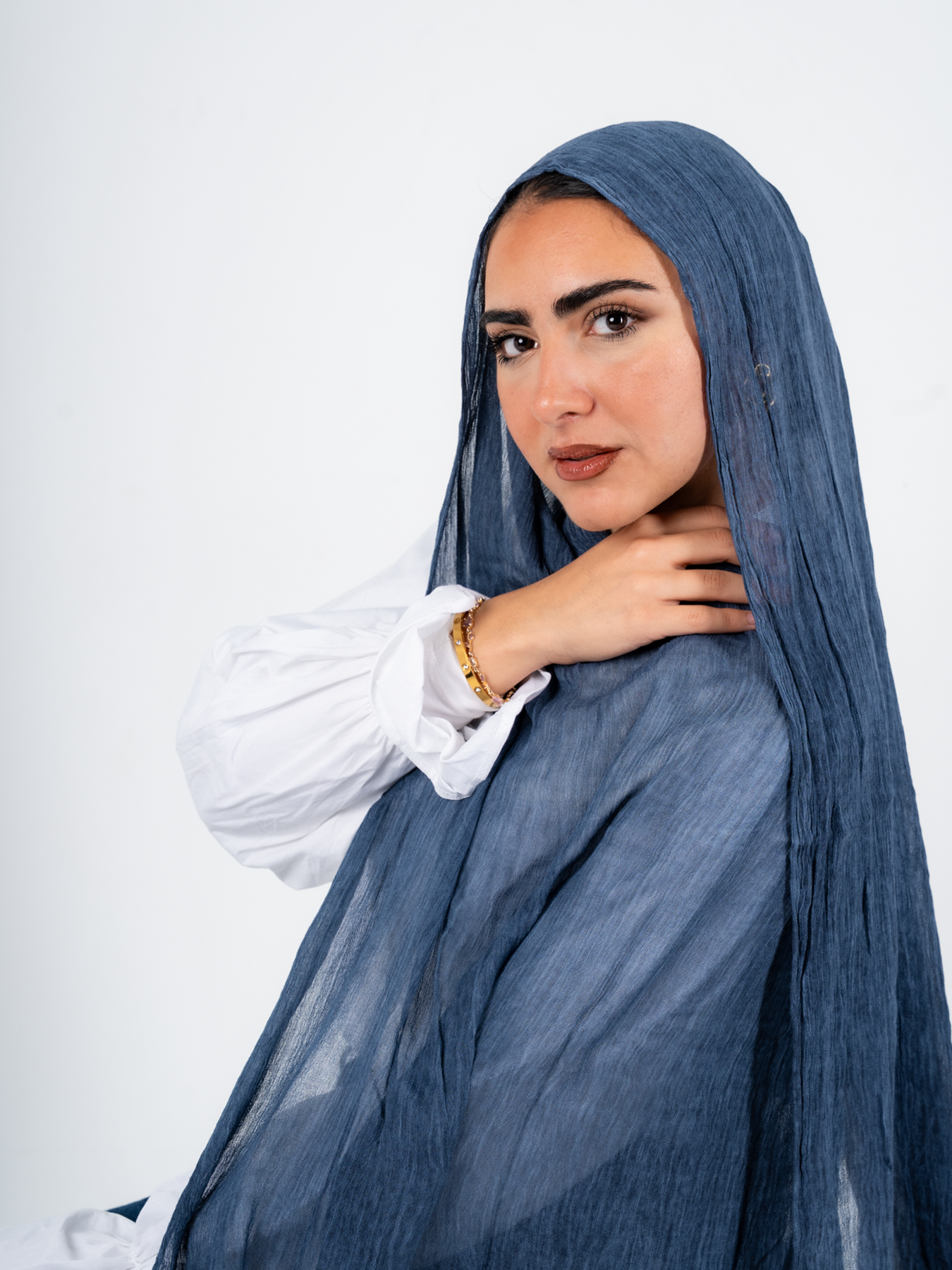 Blue jeans hijab from THT Girl, ready-to-wear modest head covering with a stylish, casual look in a natural pose.