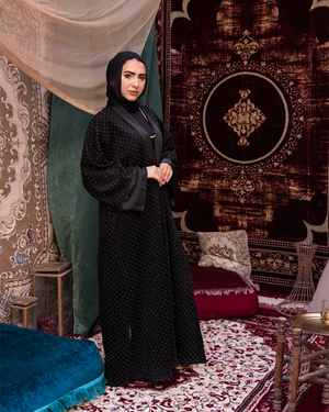 Black Samaa Kaftan by THT GIRL featuring flowing fabric and elegant design, perfect for stylish fashion wear.