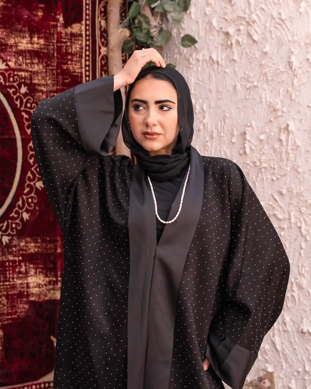 Black Samaa Kaftan by THT GIRL featuring flowing fabric and intricate detailing, perfect for stylish fashion statements.