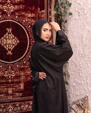 Black Samaa Kaftan by THT GIRL featuring flowing fabric and intricate design, perfect for stylish fashion wear.