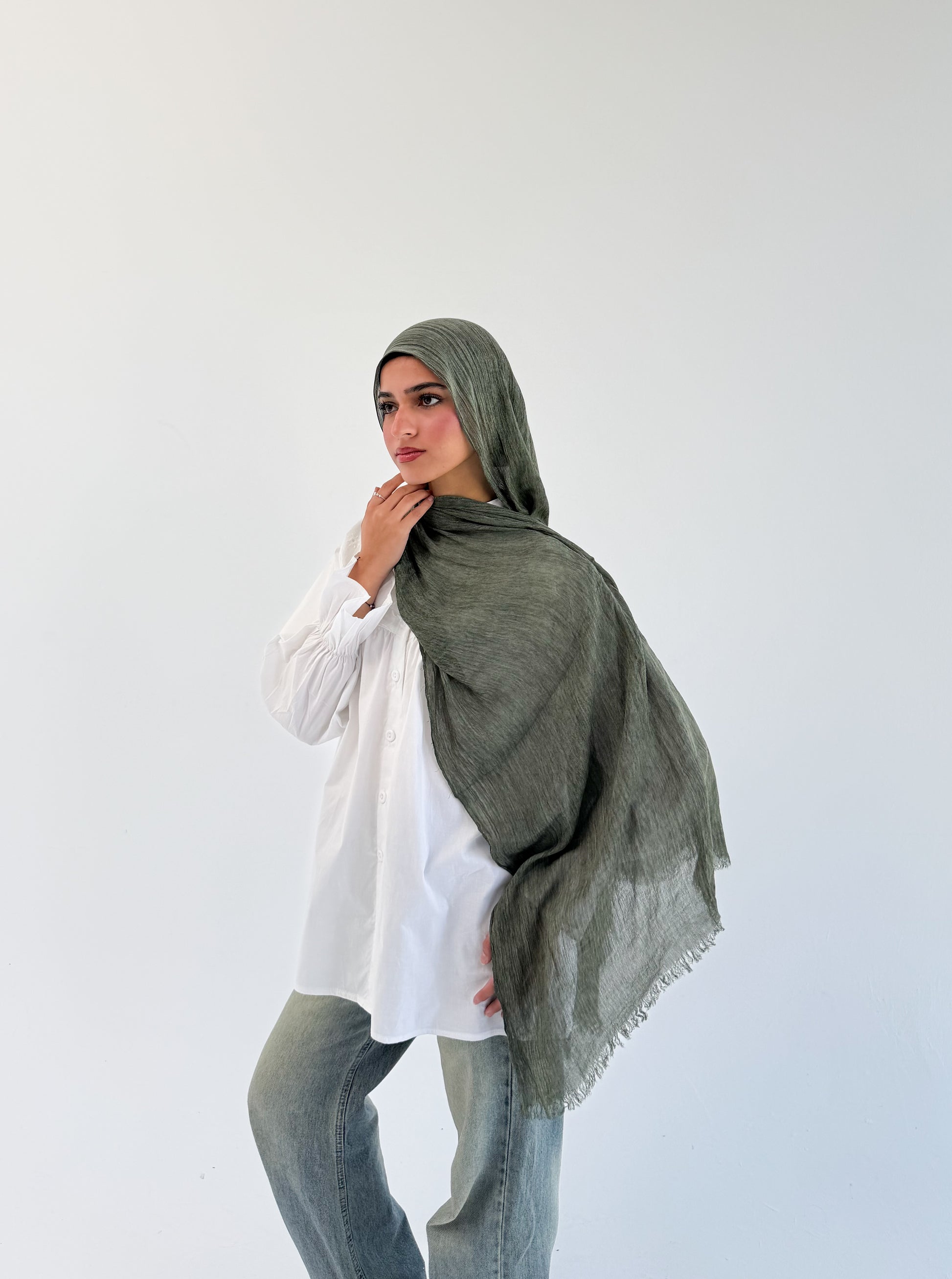 Dark olive Ready To Go hijab by THT GIRL, styled in soft fabric, shown draped on a neutral background for everyday wear.