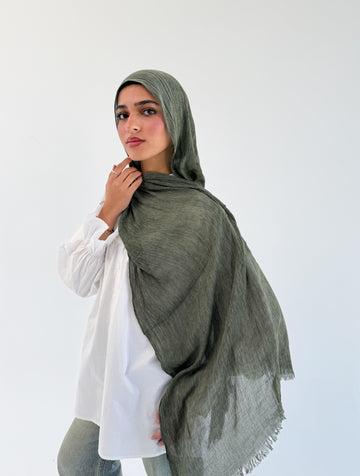Dark olive Ready To Go hijab by THT GIRL, styled in a soft, lightweight fabric, displayed on a neutral background.