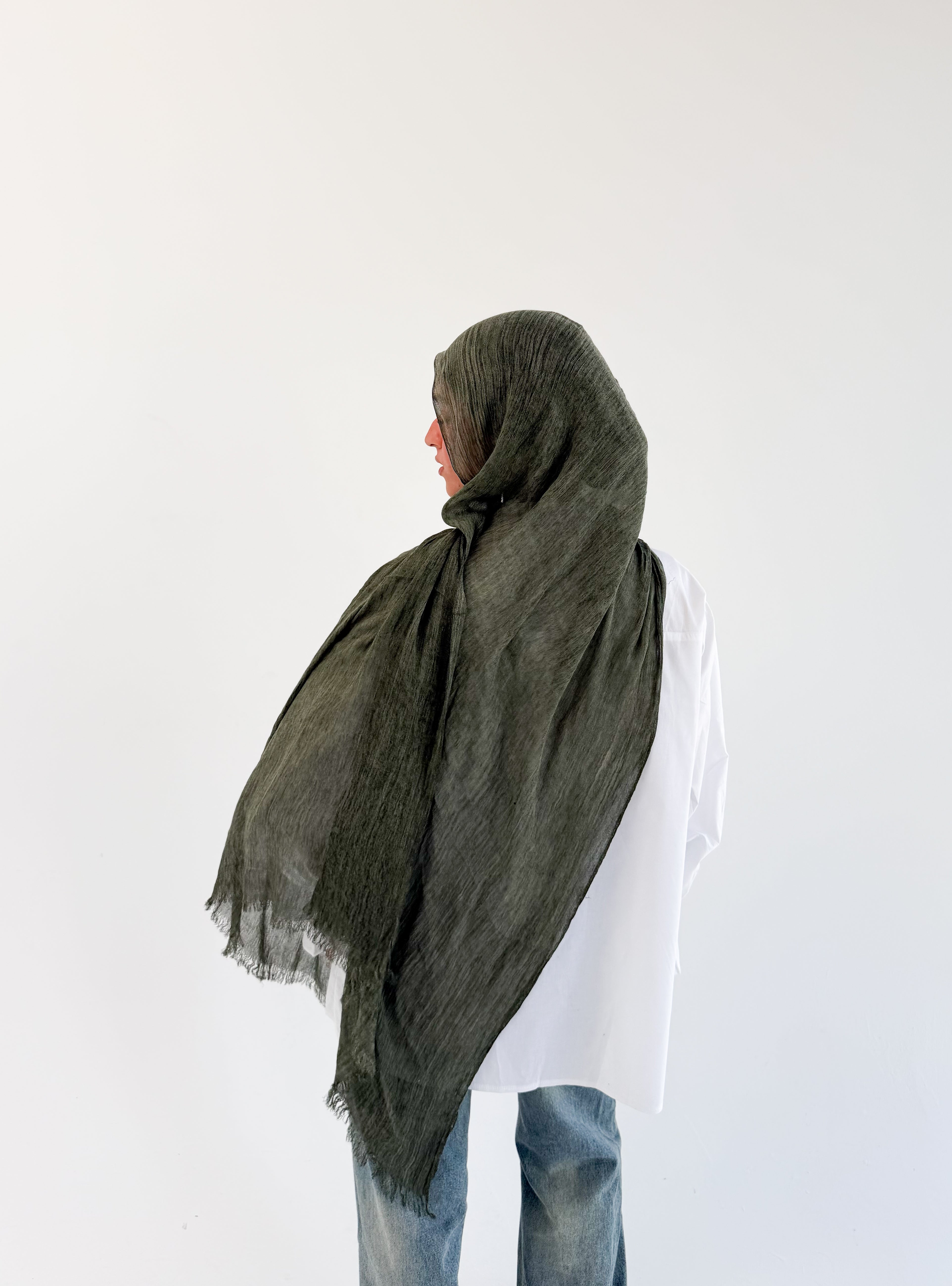 Dark olive Ready To Go hijab by THT GIRL displayed flat, showcasing its lightweight fabric and versatile style.