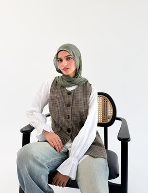 Olive check London vest by THT GIRL featuring a stylish check pattern and tailored fit, displayed on a hanger.