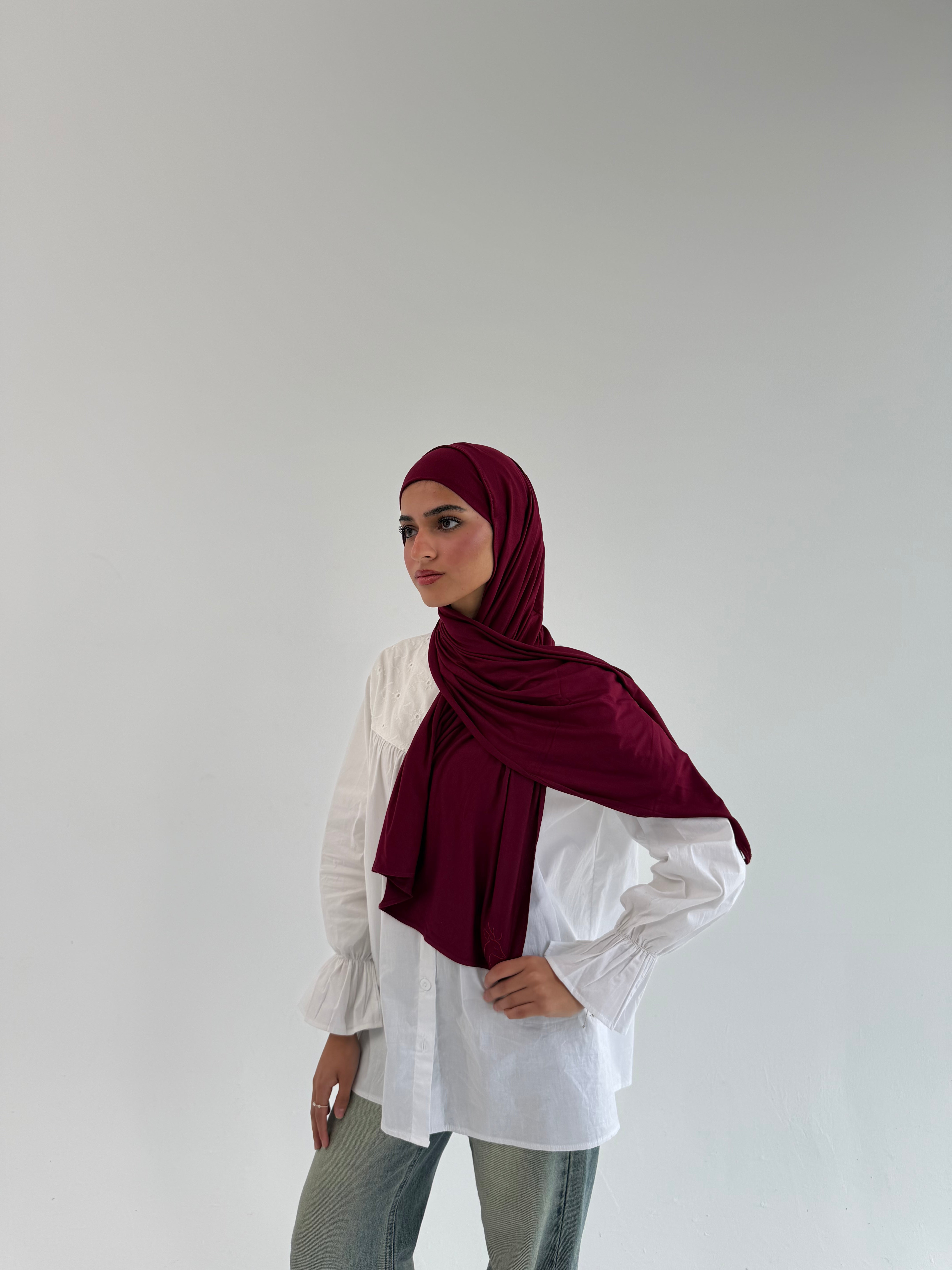Burgundy mini everyday hijab by THT GIRL displayed flat, showing soft fabric and simple style for daily wear.