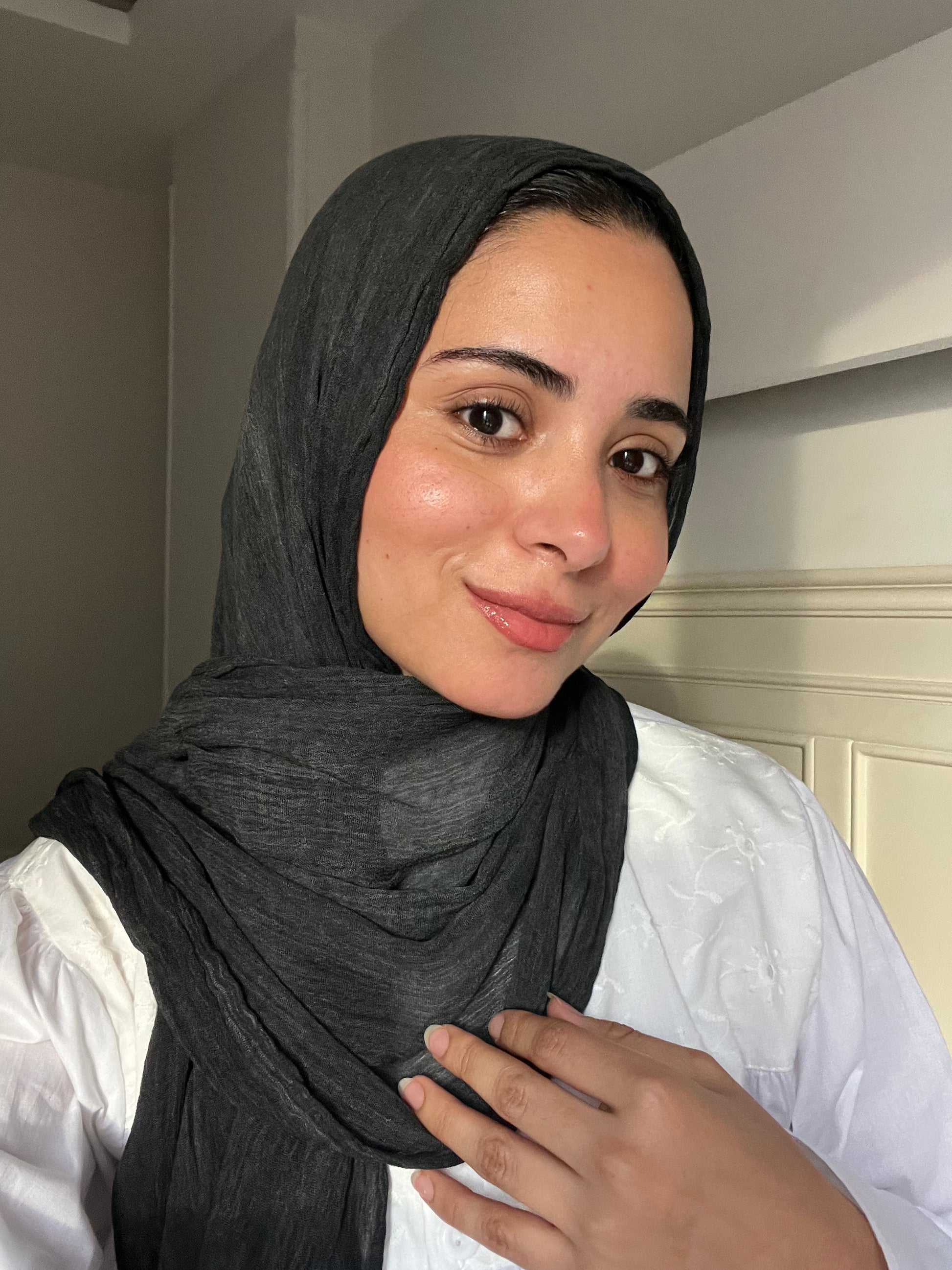 Charcoal gray Ready To Go hijab by THT GIRL displayed flat, showcasing its smooth fabric and versatile style for easy wear.