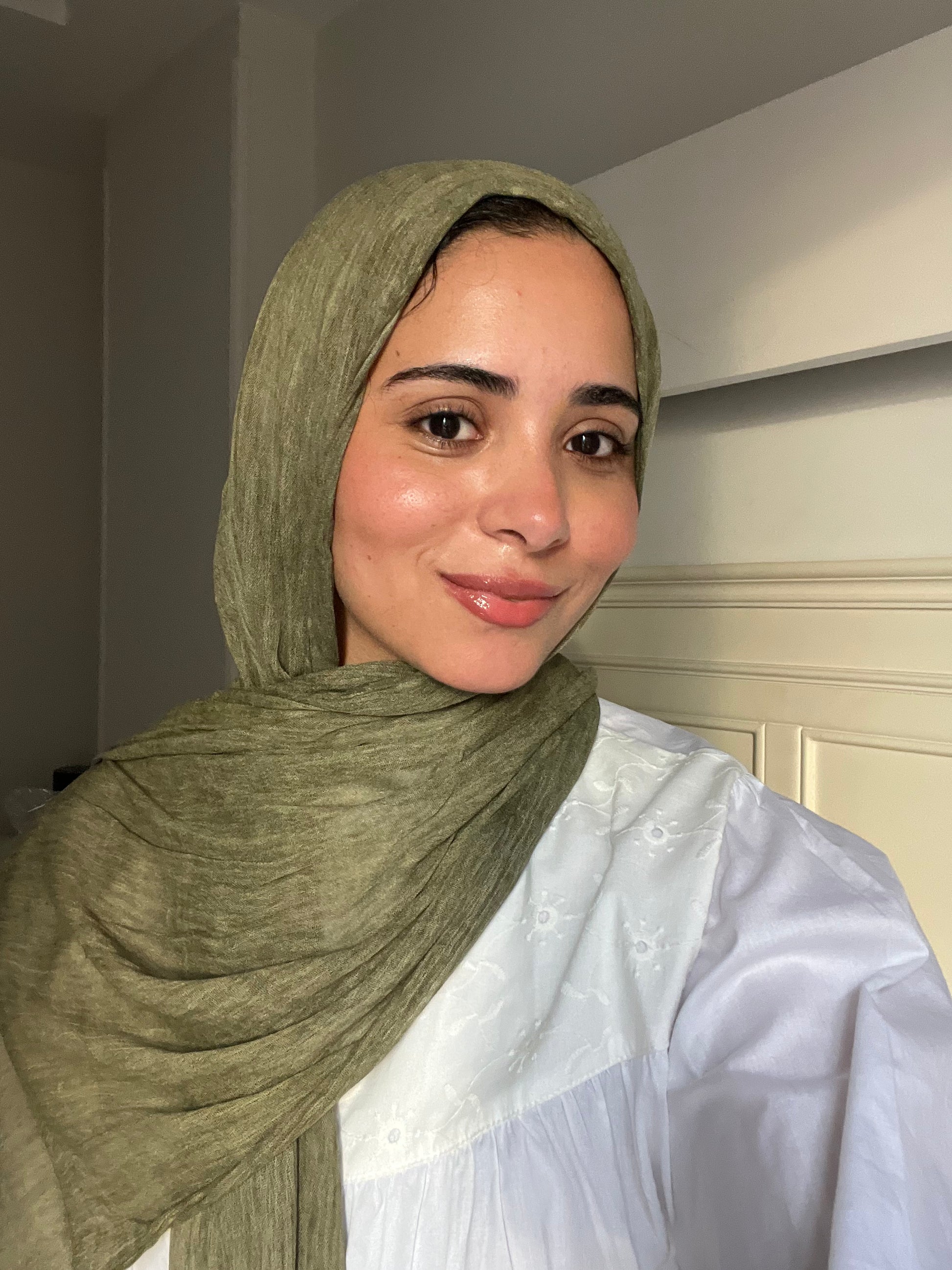 Dark olive Ready To Go hijab by THT GIRL displayed flat on a neutral background, showcasing its fabric and color.
