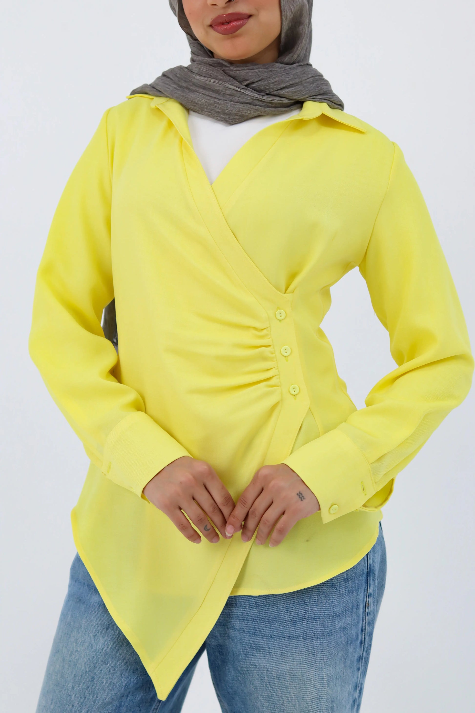 Yellow shirt featuring a deer graphic from THT GIRL, shown hanging on a hanger with a simple background.