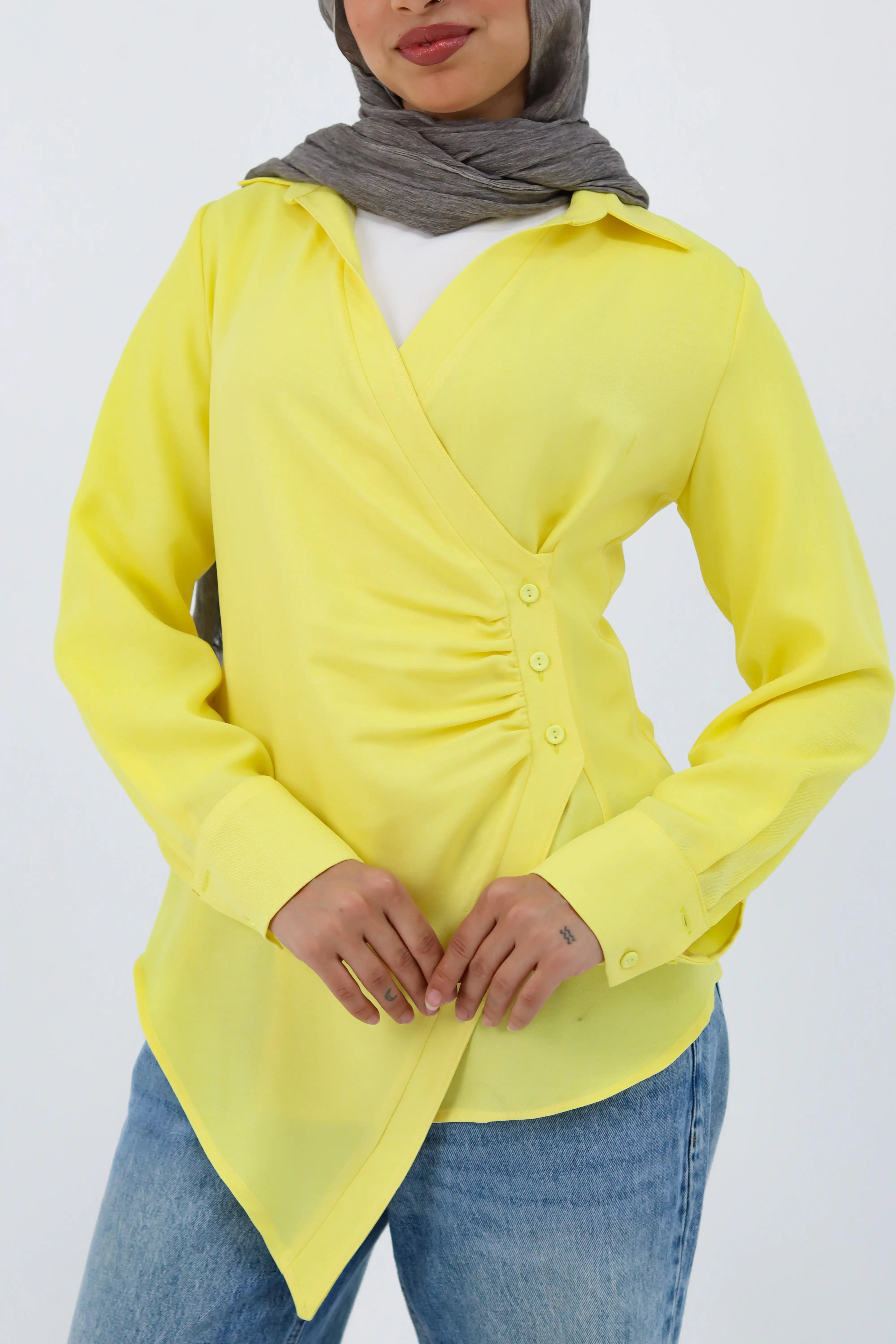 Yellow shirt featuring a deer graphic from THT GIRL, shown hanging on a hanger with a simple background.