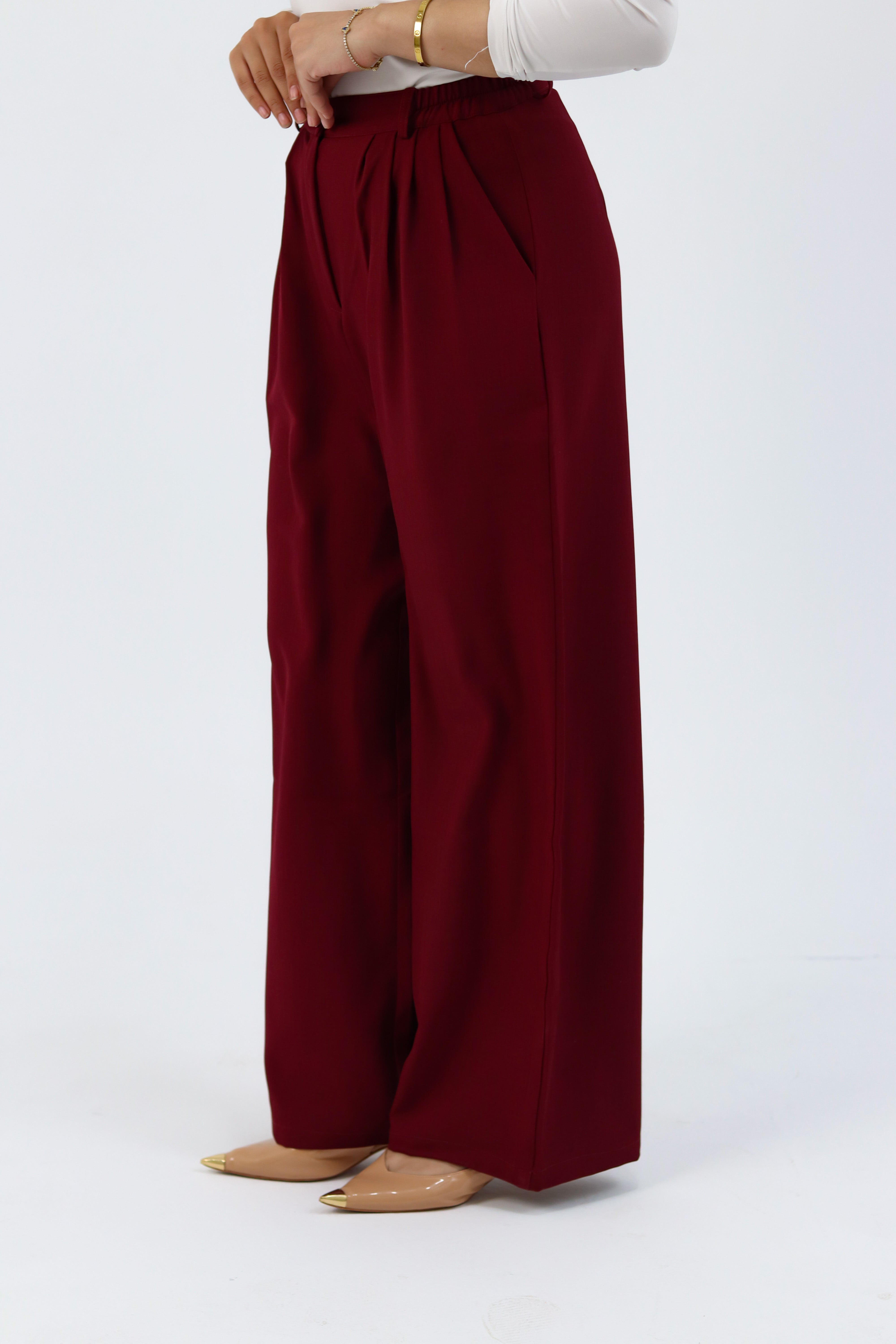 THT GIRL burgundy loose pants with relaxed fit and elastic waistband, displayed on a hanger.