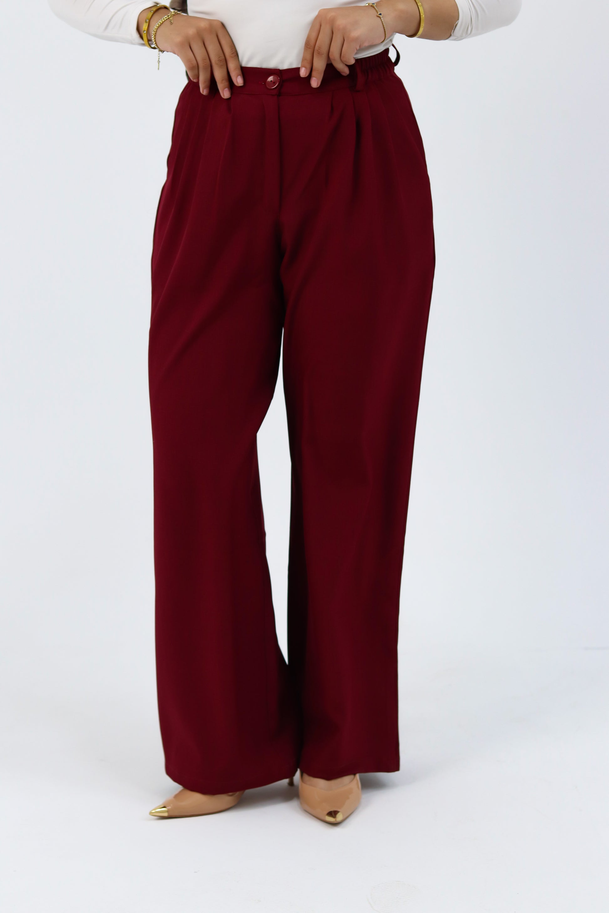 THT GIRL burgundy loose pants with relaxed fit, featuring soft fabric and casual style, shown on a model.