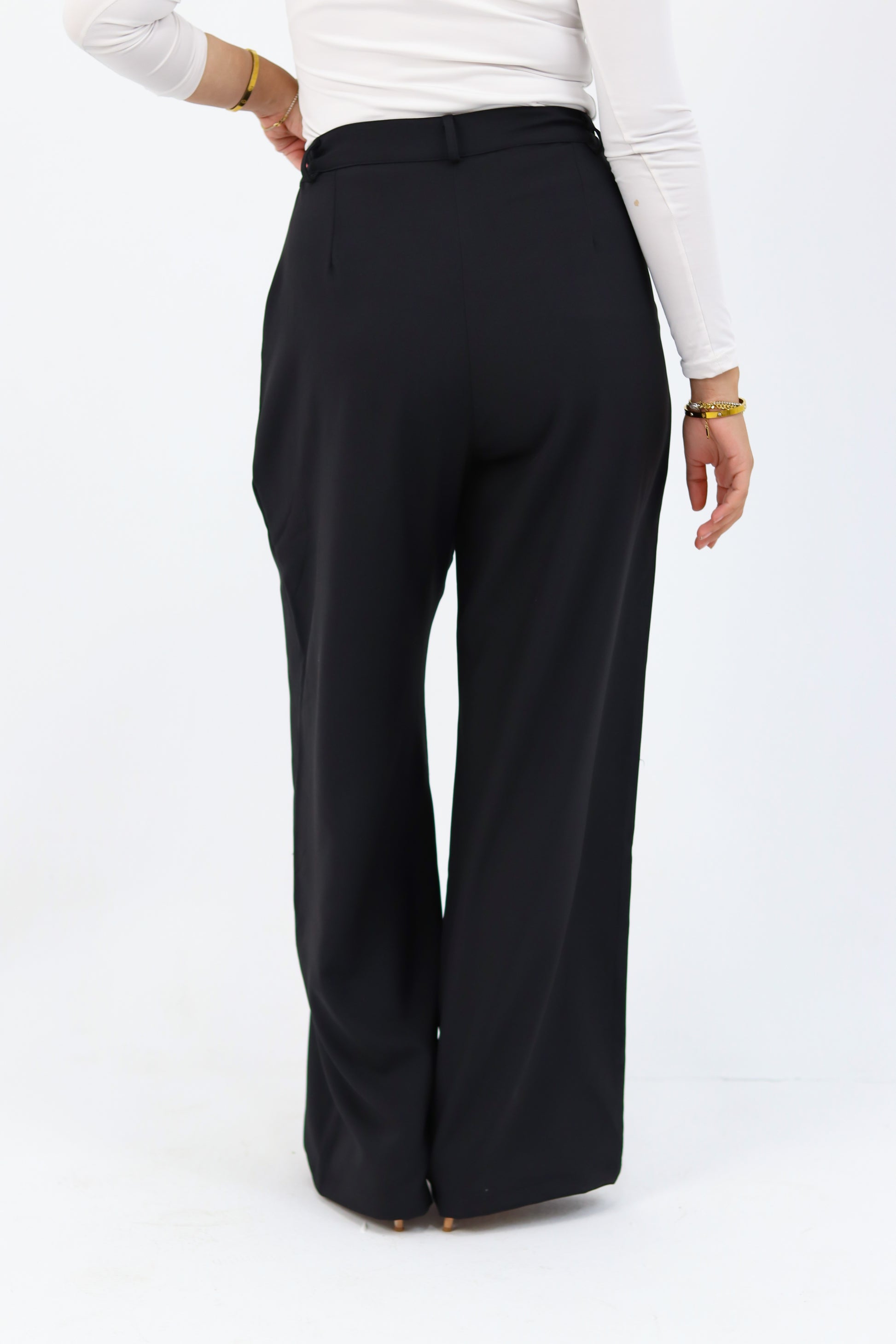 Black loose pants by THT GIRL displayed on a model, showing relaxed fit and casual style.