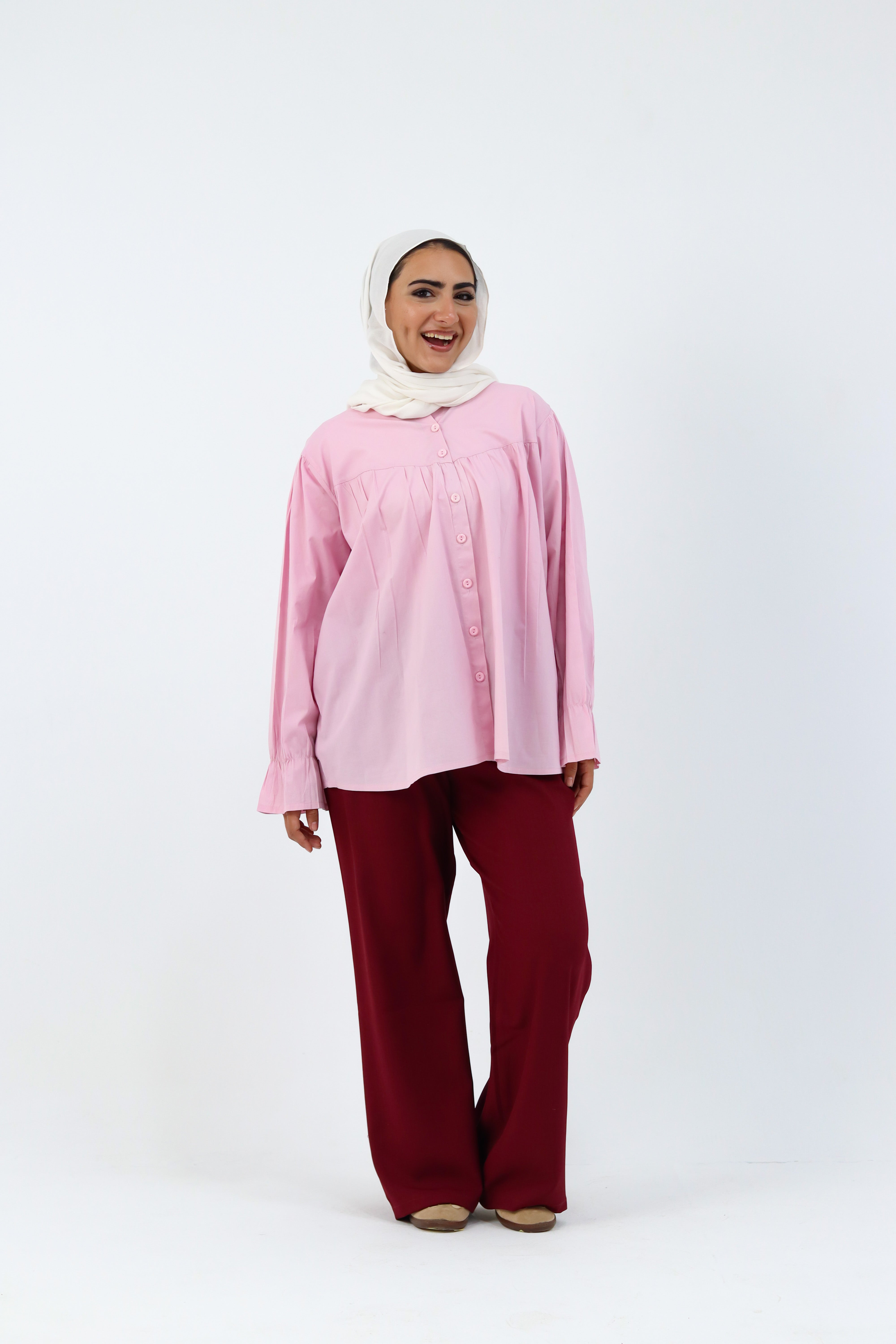 Baby pink THT GIRL Lady Blouse displayed on a hanger, showcasing its soft fabric and stylish design.