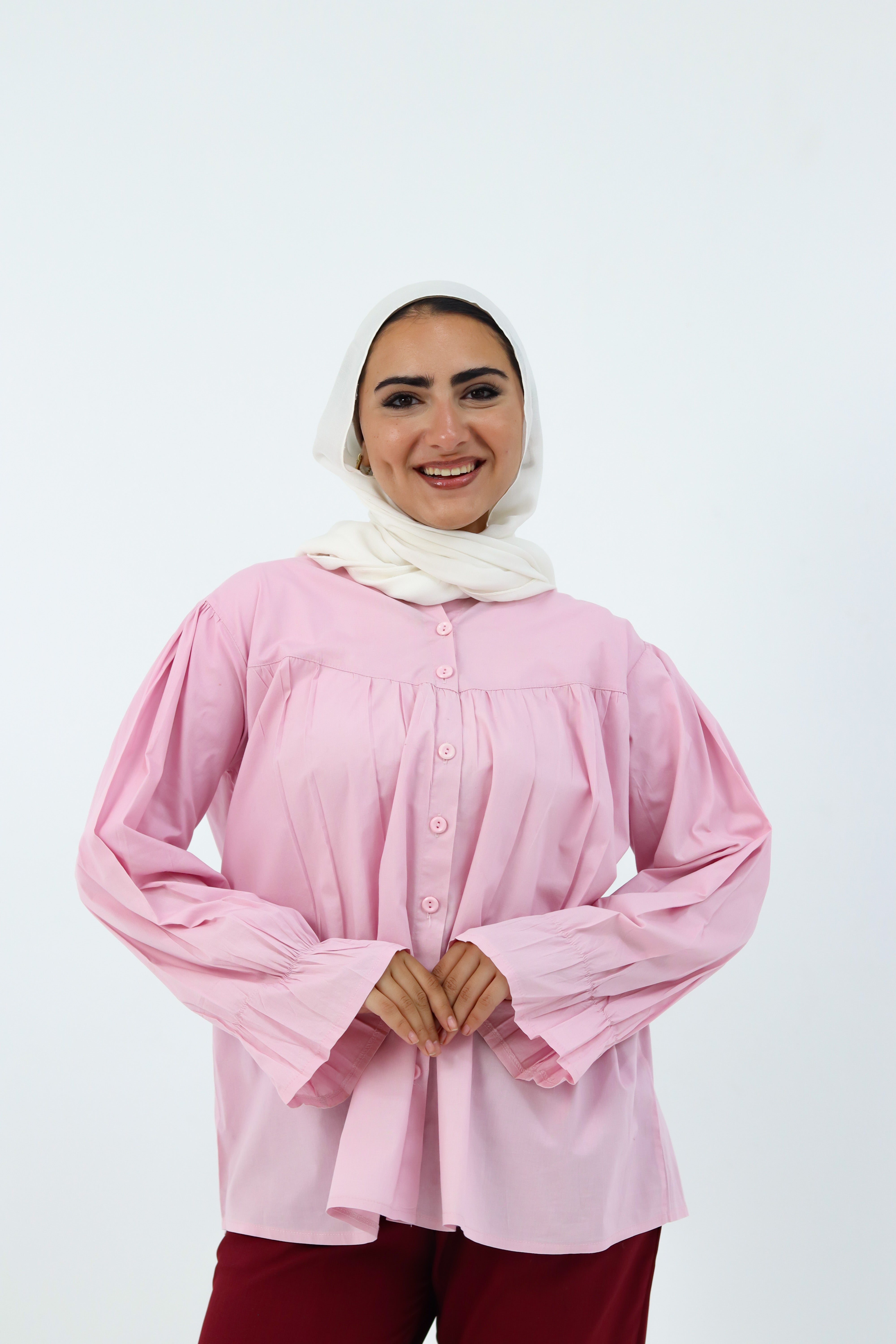 Baby pink THT GIRL Lady Blouse with long sleeves and a stylish collar, displayed on a hanger.
