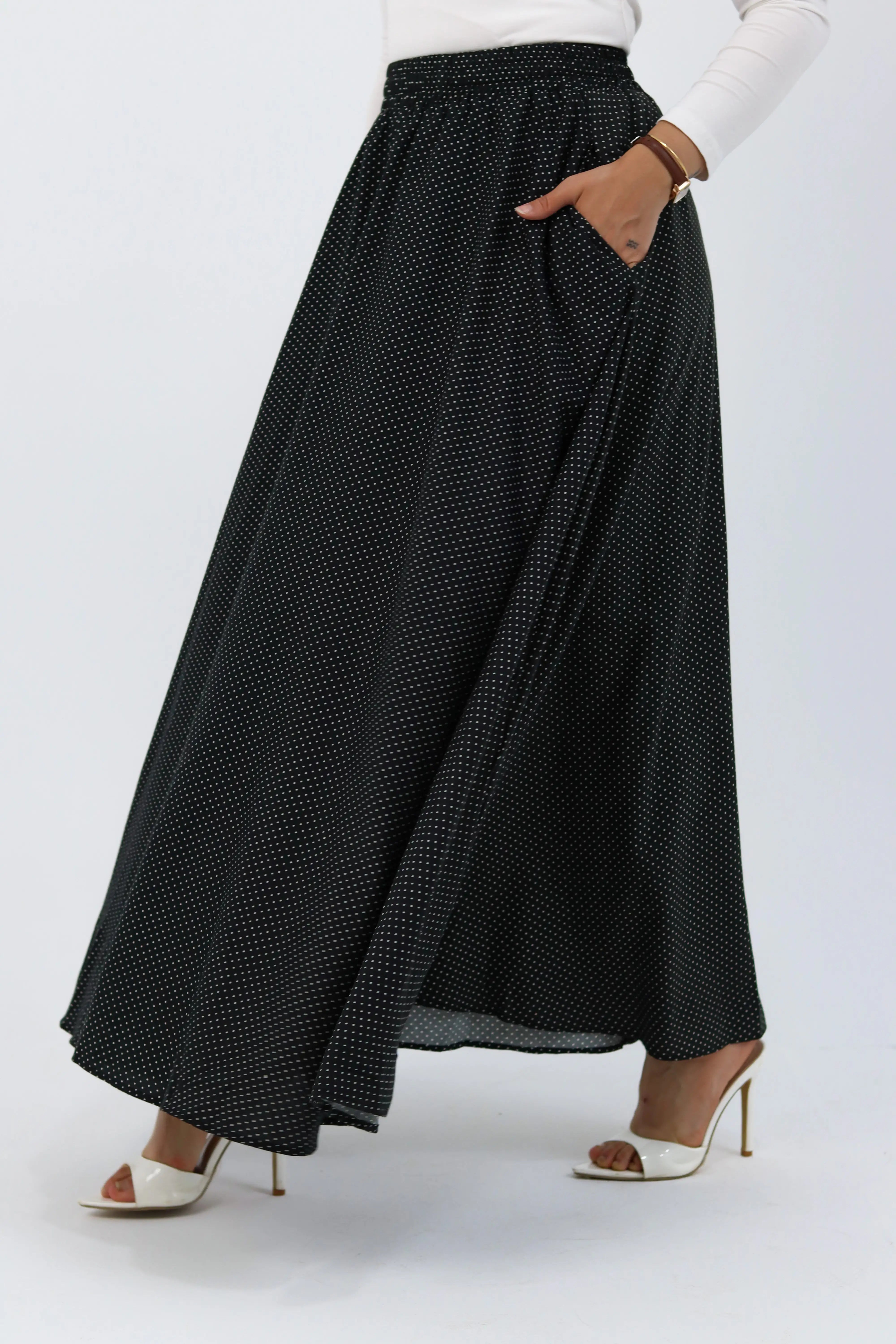 Black Riviera skirt paired with a THT Girl blouse, showing a stylish, casual outfit with a fitted black skirt and trendy top.