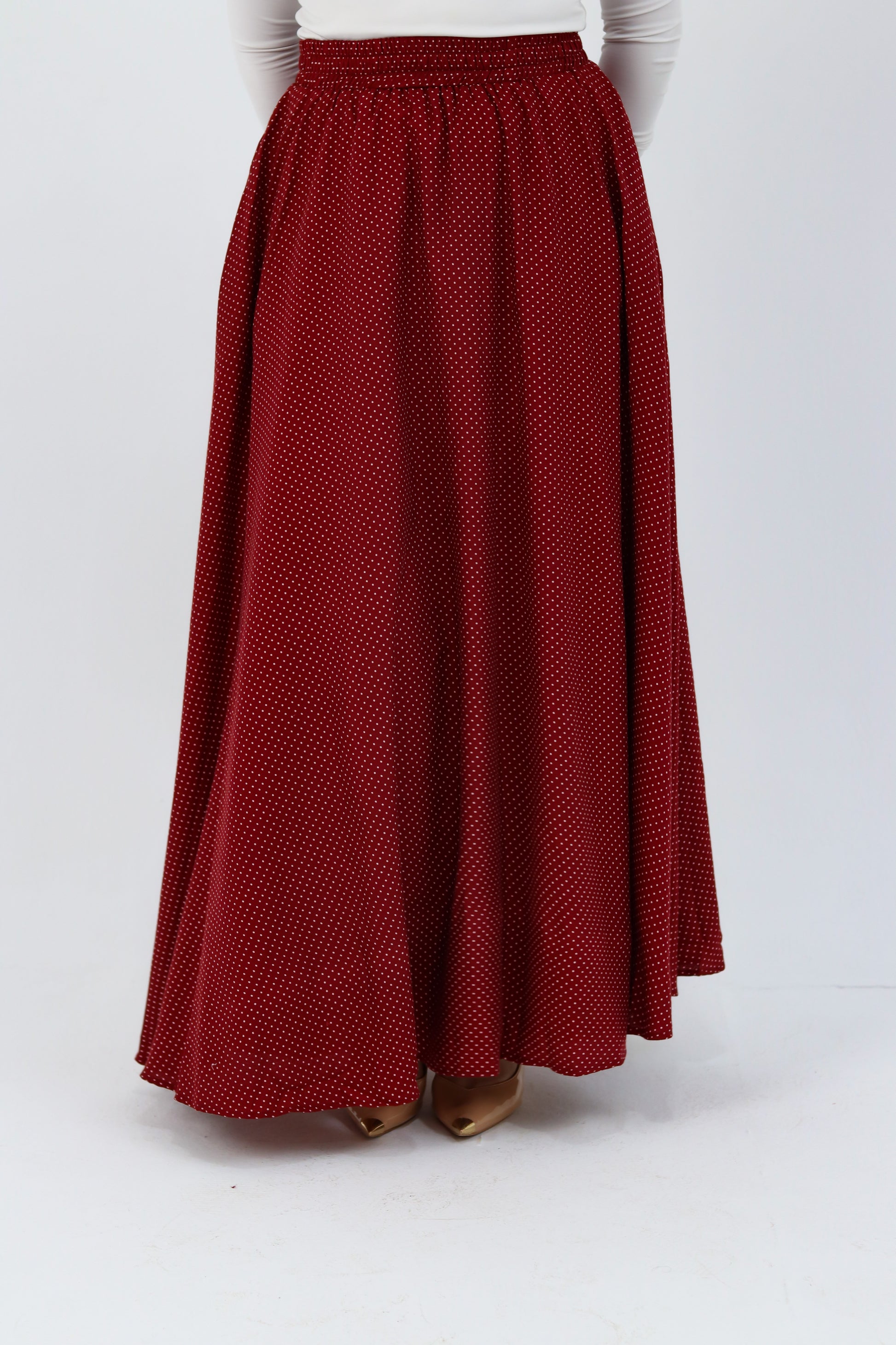 THT GIRL Riviera burgundy skirt paired with a stylish blouse, showcasing a fashionable and elegant outfit.