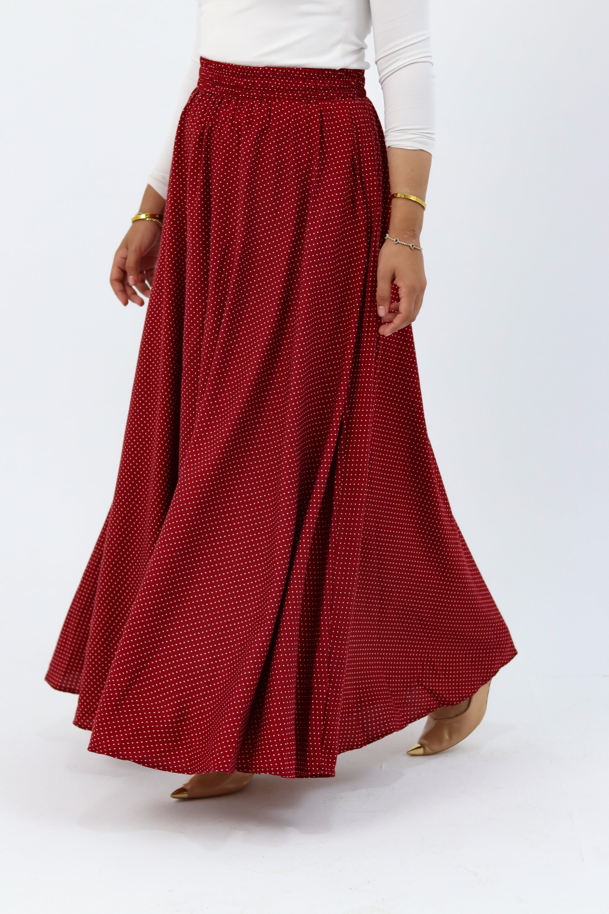 THT GIRL Riviera burgundy skirt paired with a stylish blouse, showcasing a fashionable and elegant outfit.