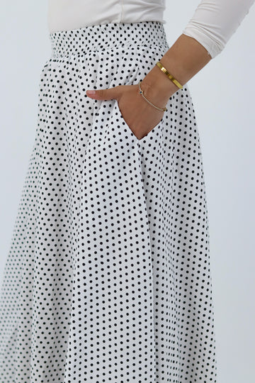 White Riviera skirt from THT GIRL paired with a stylish blouse, showcasing a chic and casual outfit.