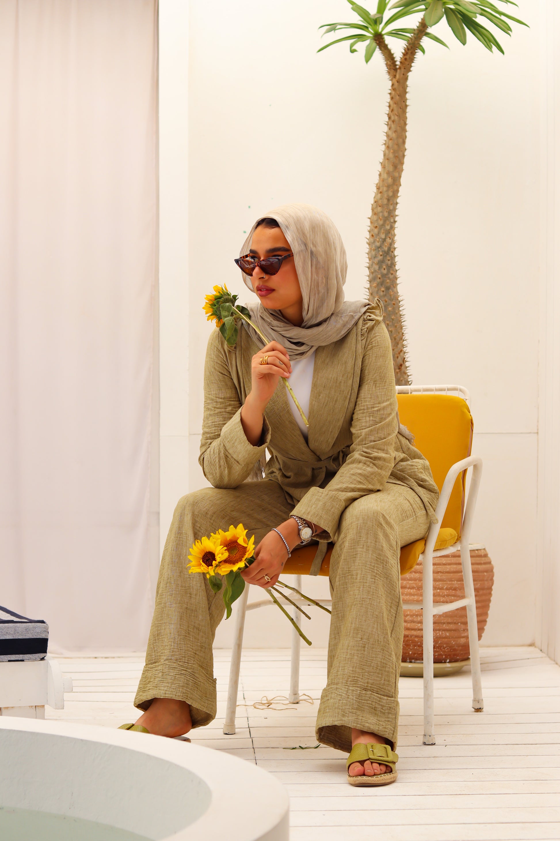 Olive Roe Suit by THT GIRL, stylish fashion outfit featuring a tailored jacket and matching pants, displayed on a hanger.