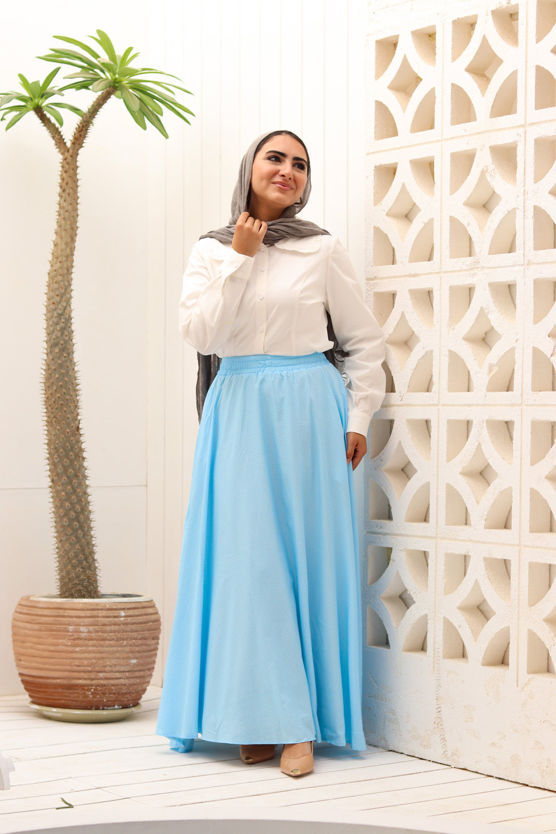 THT GIRL baby blue Riviera skirt paired with a matching blouse, displayed on a hanger.