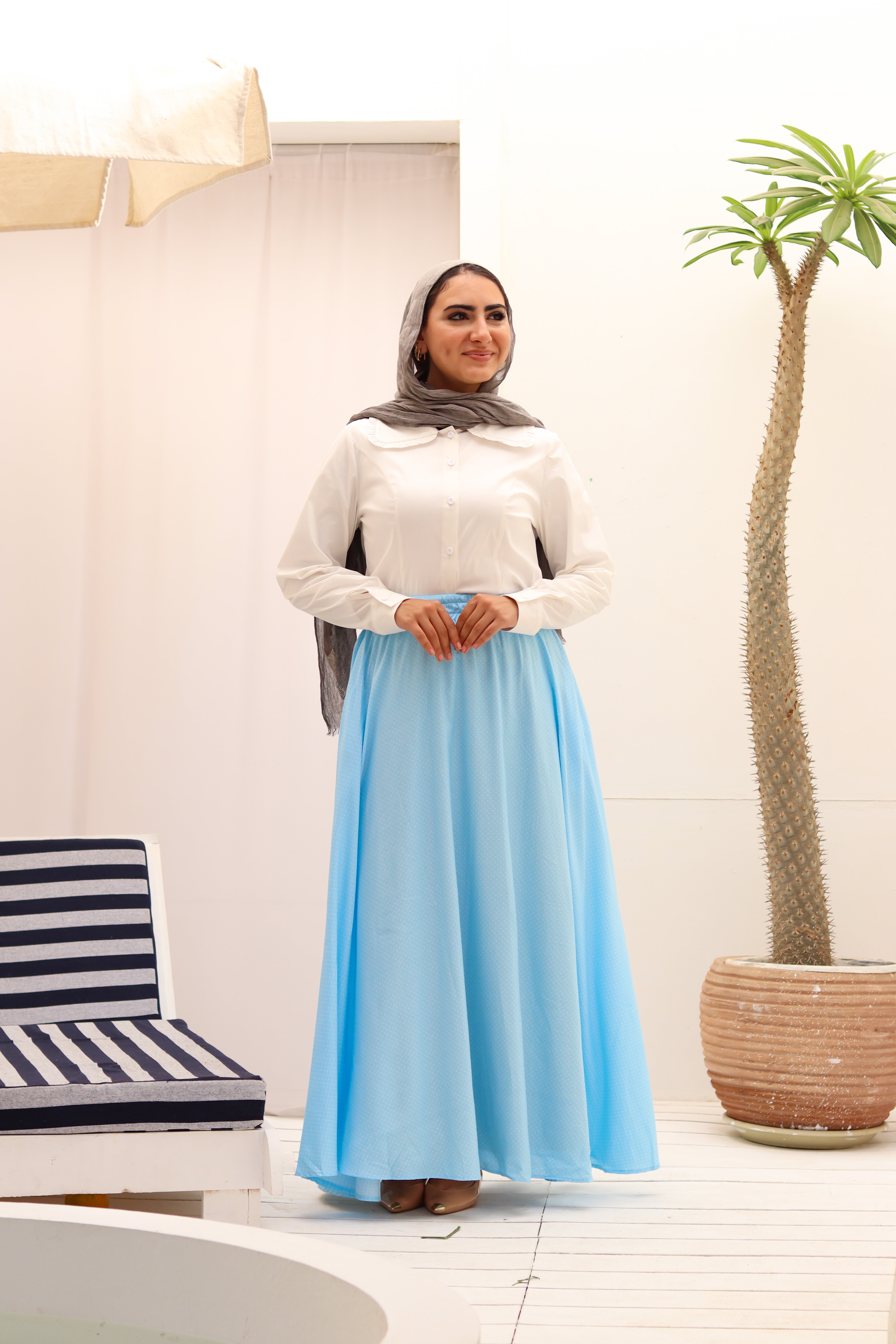 THT GIRL Riviera baby blue blouse with ruffled collar and long sleeves, displayed on a hanger.