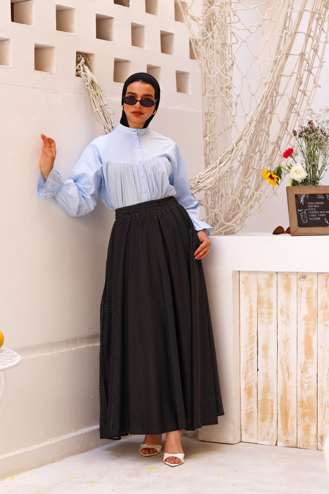 Baby blue THT GIRL Lady Blouse with long sleeves, lightweight fabric, and a relaxed fit, styled on a hanger.