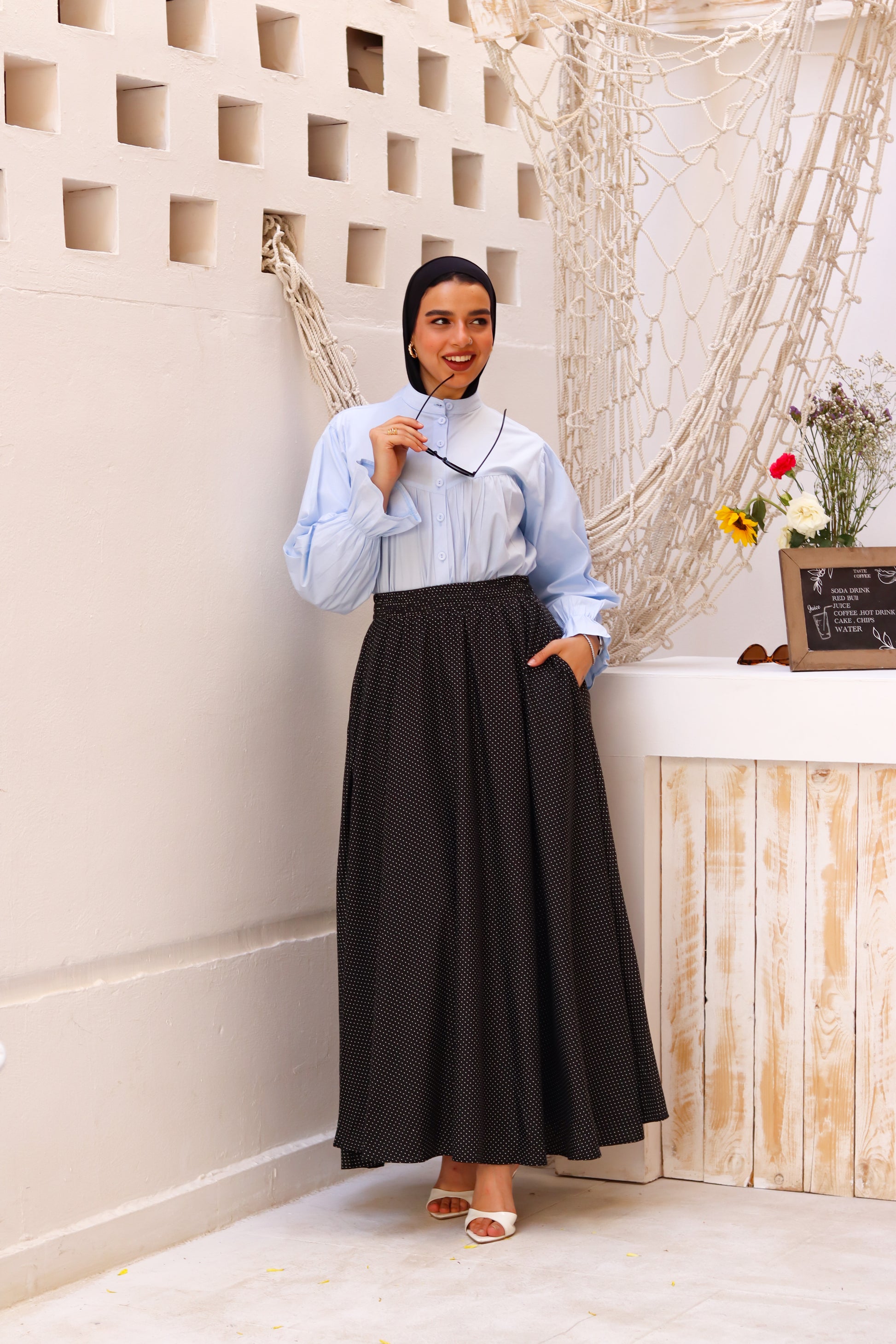 Baby blue THT GIRL Lady Blouse with long sleeves and a classic fit, displayed on a hanger.