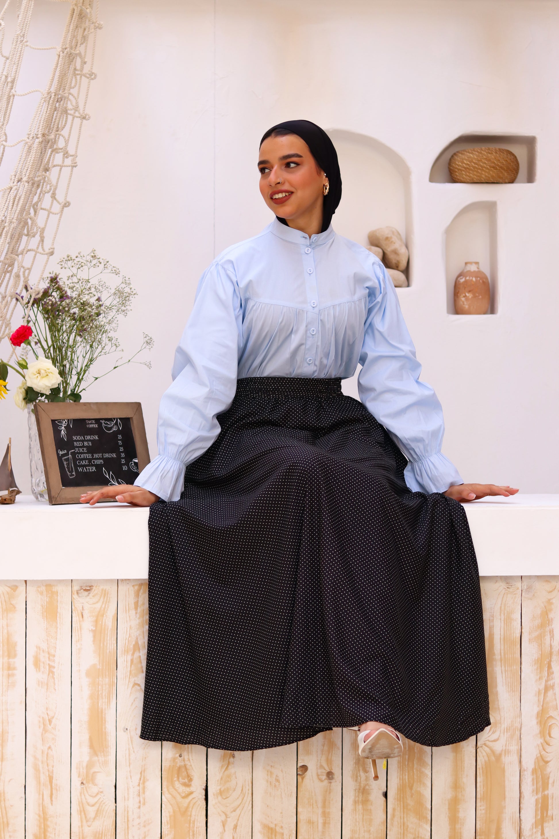 Baby blue THT GIRL Lady Blouse with long sleeves and a relaxed fit, displayed on a hanger.