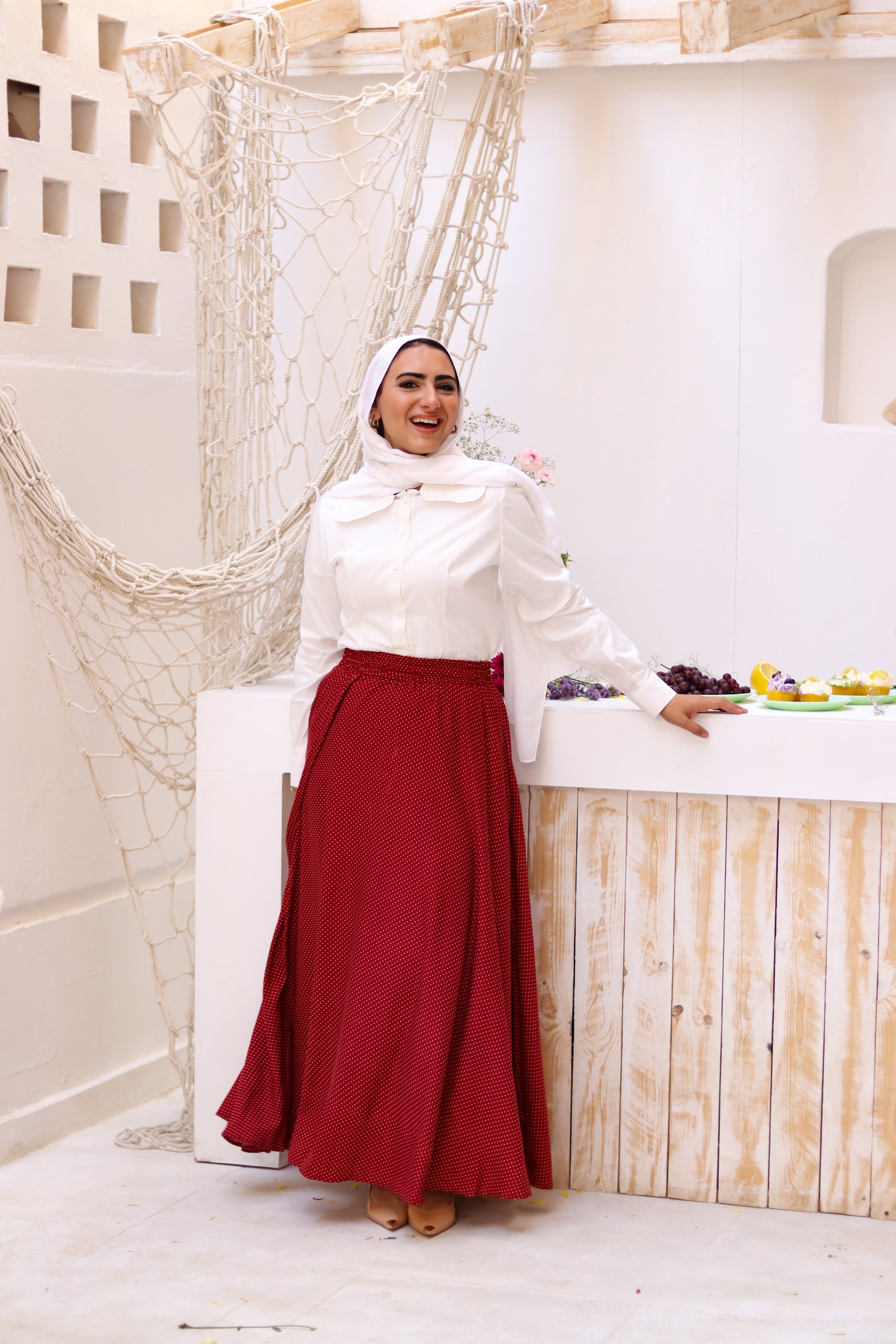 THT GIRL Riviera burgundy skirt paired with a stylish blouse, showcasing a trendy and elegant fashion look.