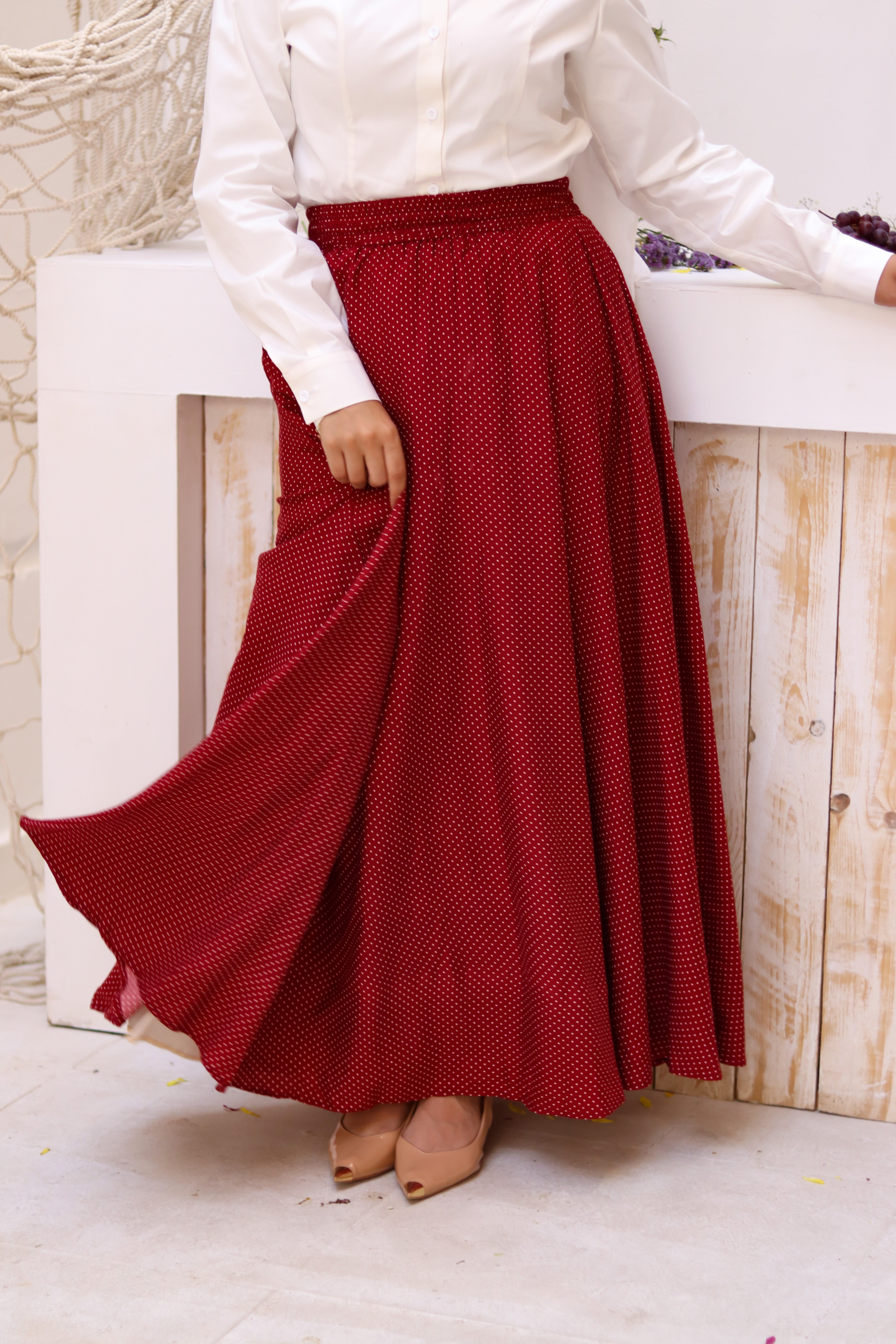 THT GIRL Riviera burgundy skirt paired with a stylish blouse, featuring a fitted waist and elegant fabric.