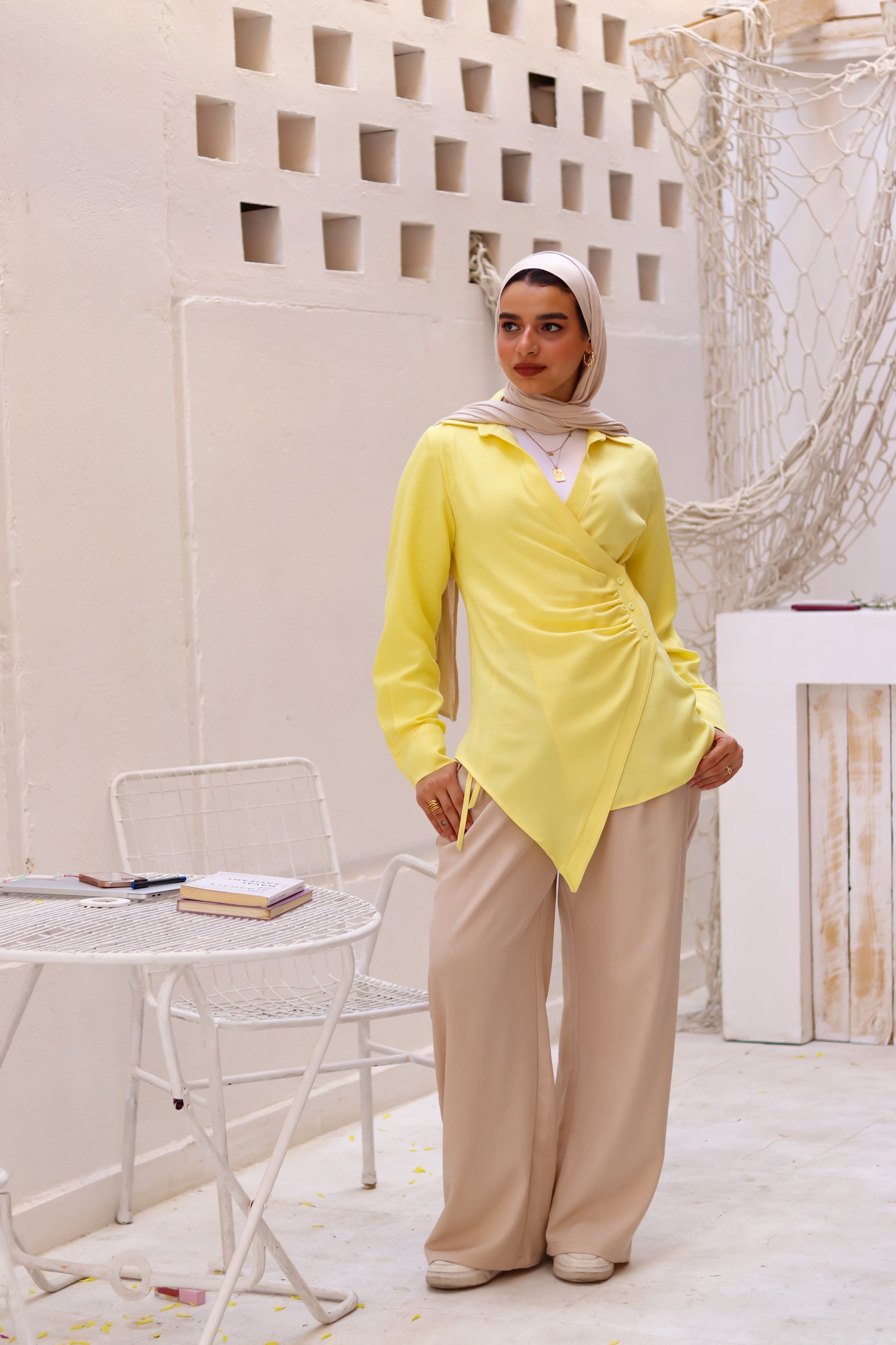 Beige loose pants by THT GIRL displayed on a model, showcasing relaxed fit and comfortable casual style.