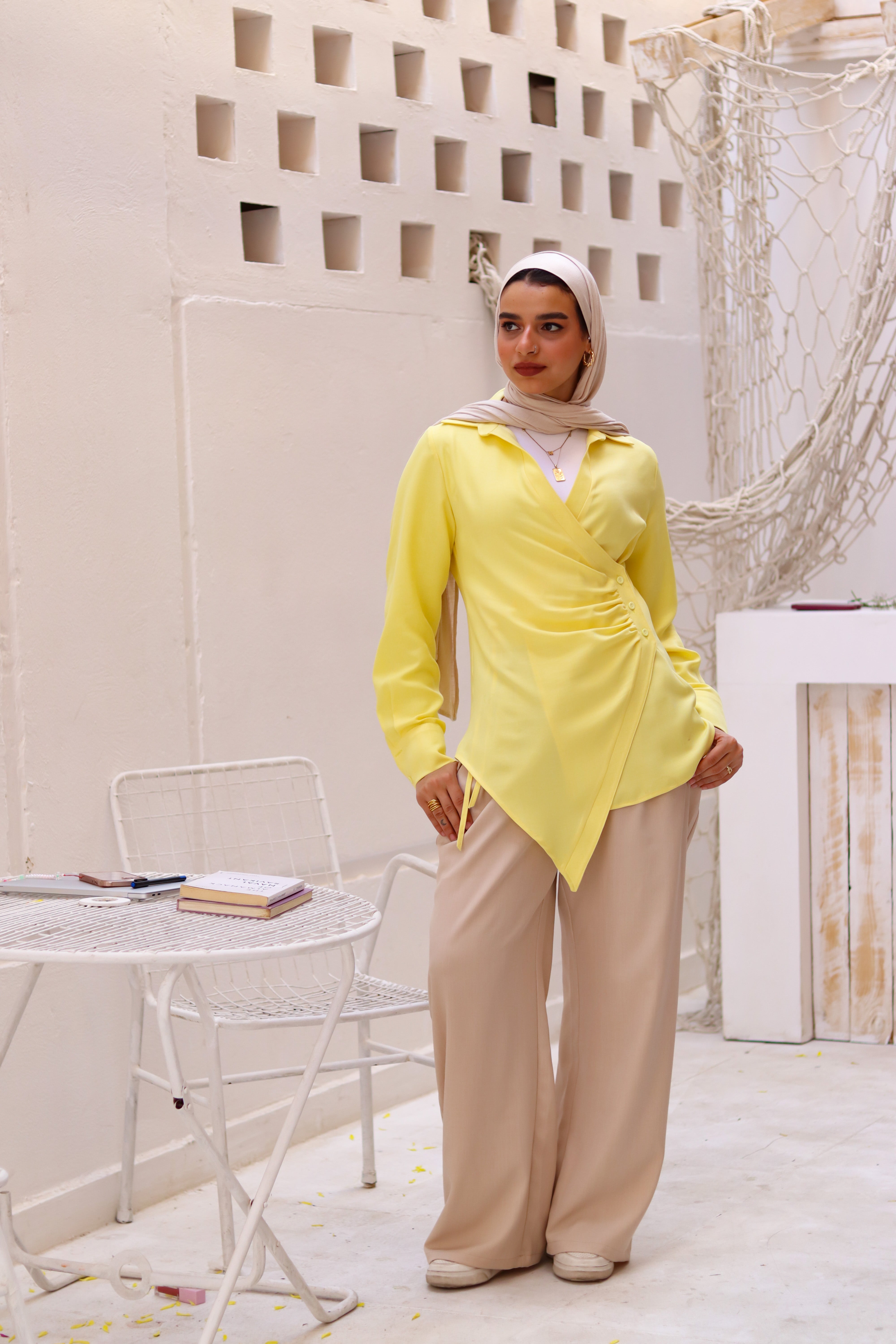 Beige loose pants by THT GIRL displayed on a model, showcasing relaxed fit and comfortable casual style.