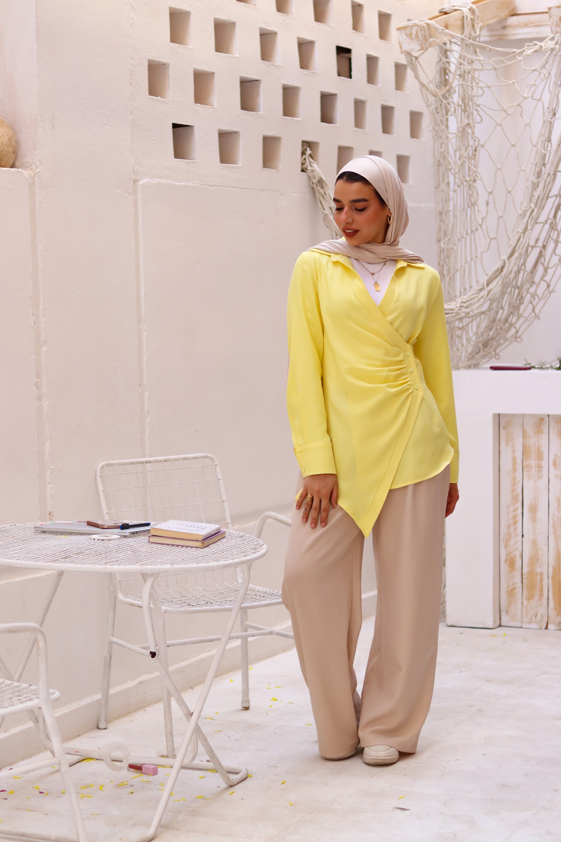 Beige loose pants from THT GIRL featuring a relaxed fit and casual style, shown on a model.