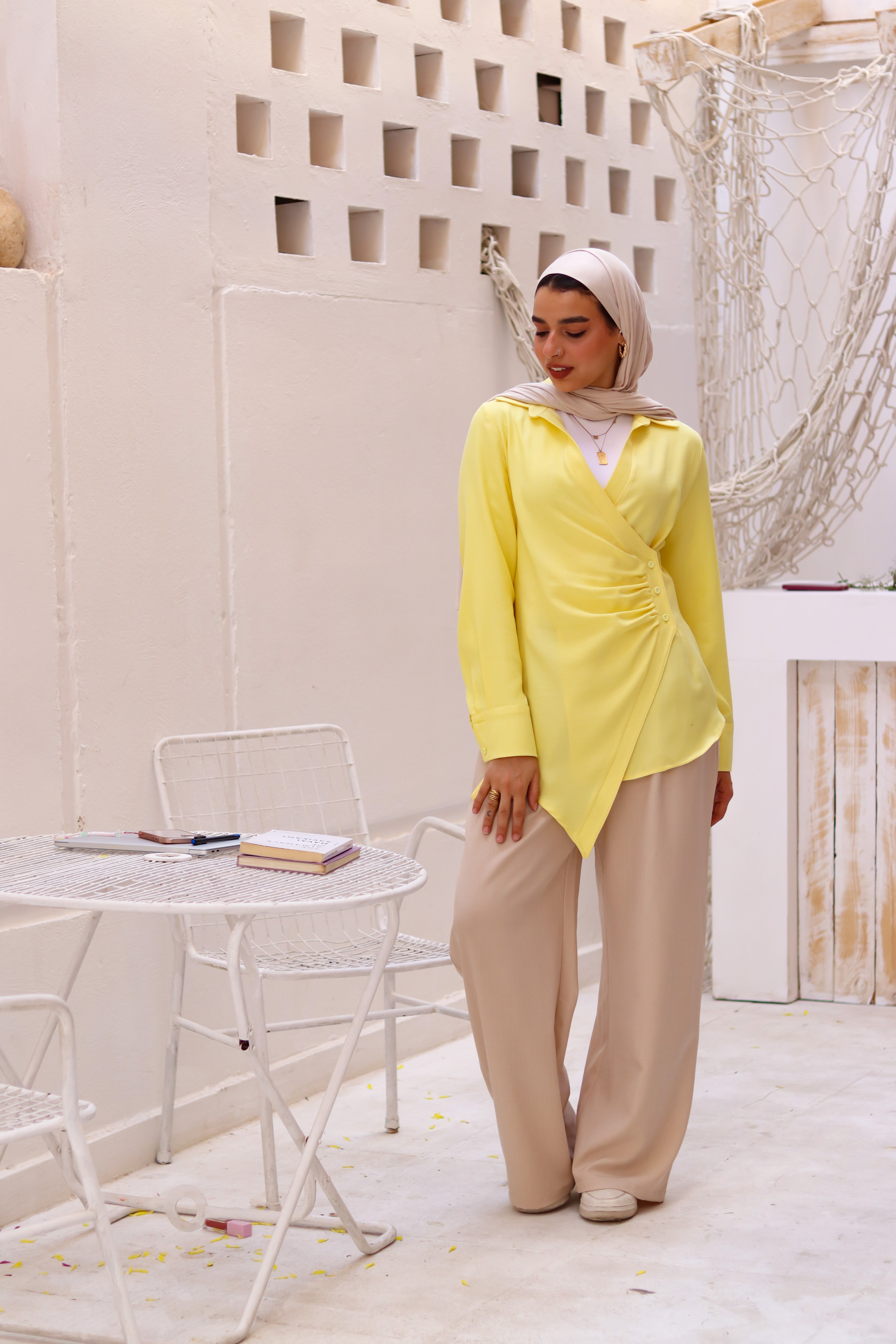 Beige loose pants from THT GIRL featuring a relaxed fit and casual style, shown on a model.