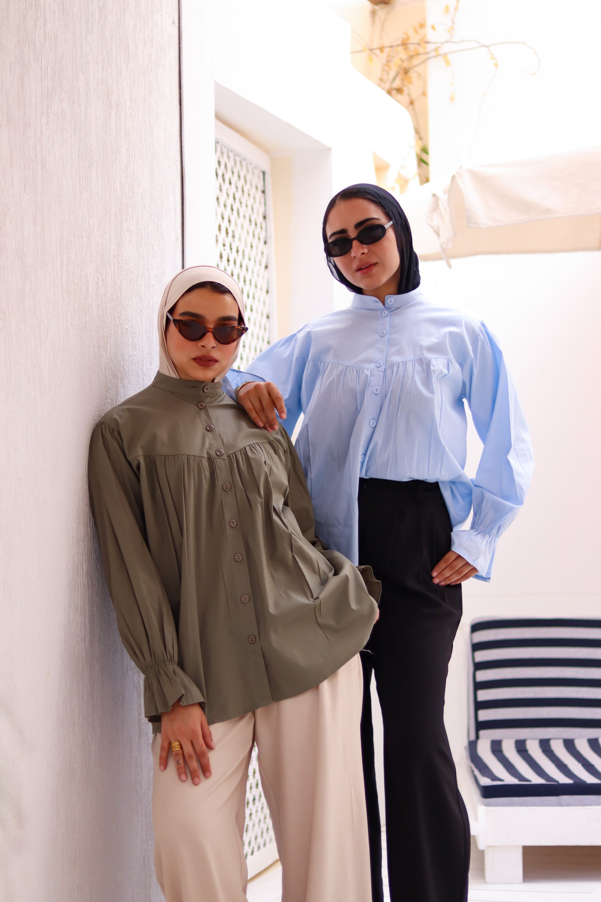 Olive THT GIRL Lady Blouse displayed on a hanger, featuring long sleeves and a relaxed fit for casual or office wear.